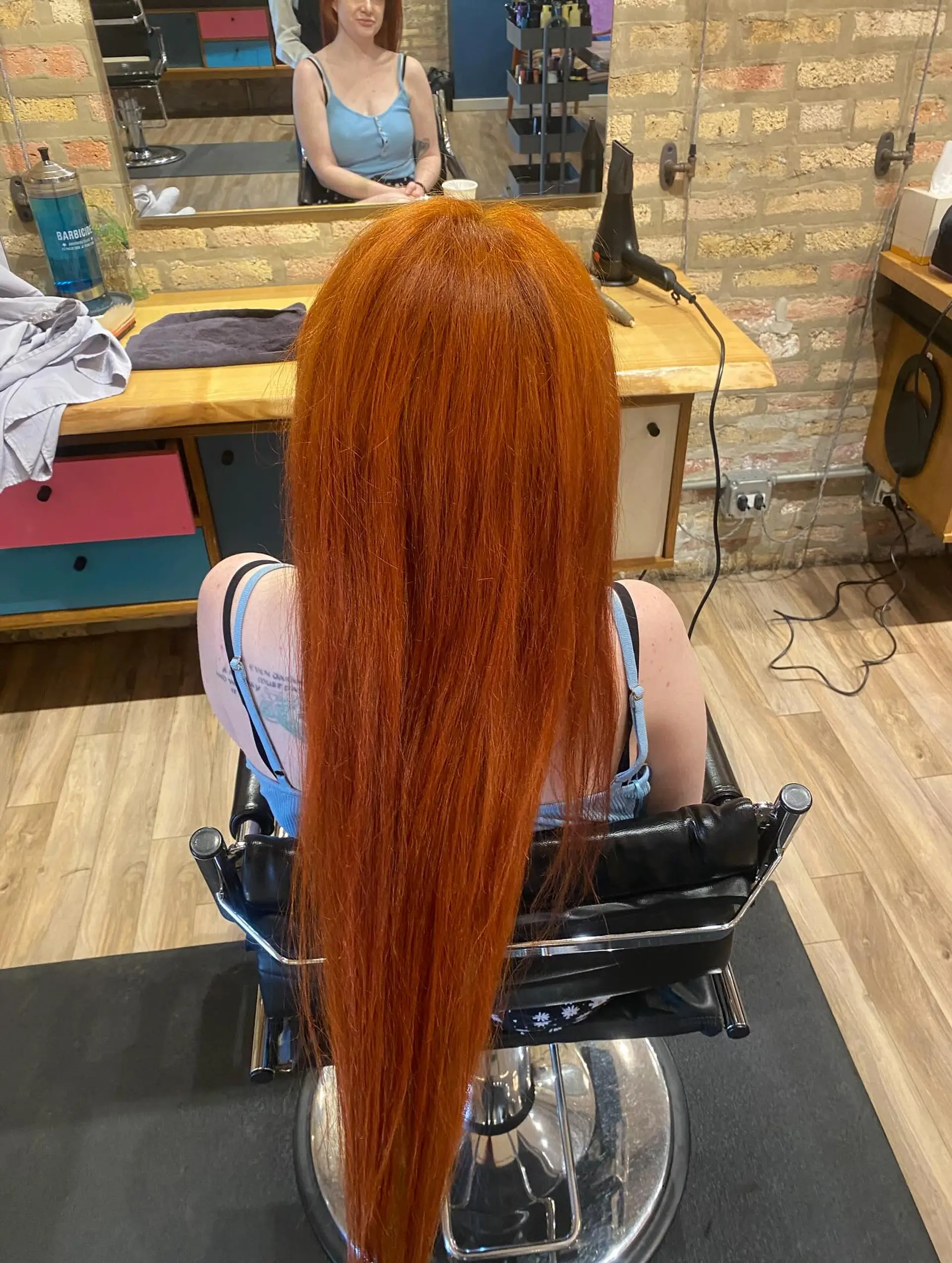 A very long, straight hairstyle with a beautiful copper red color. 1