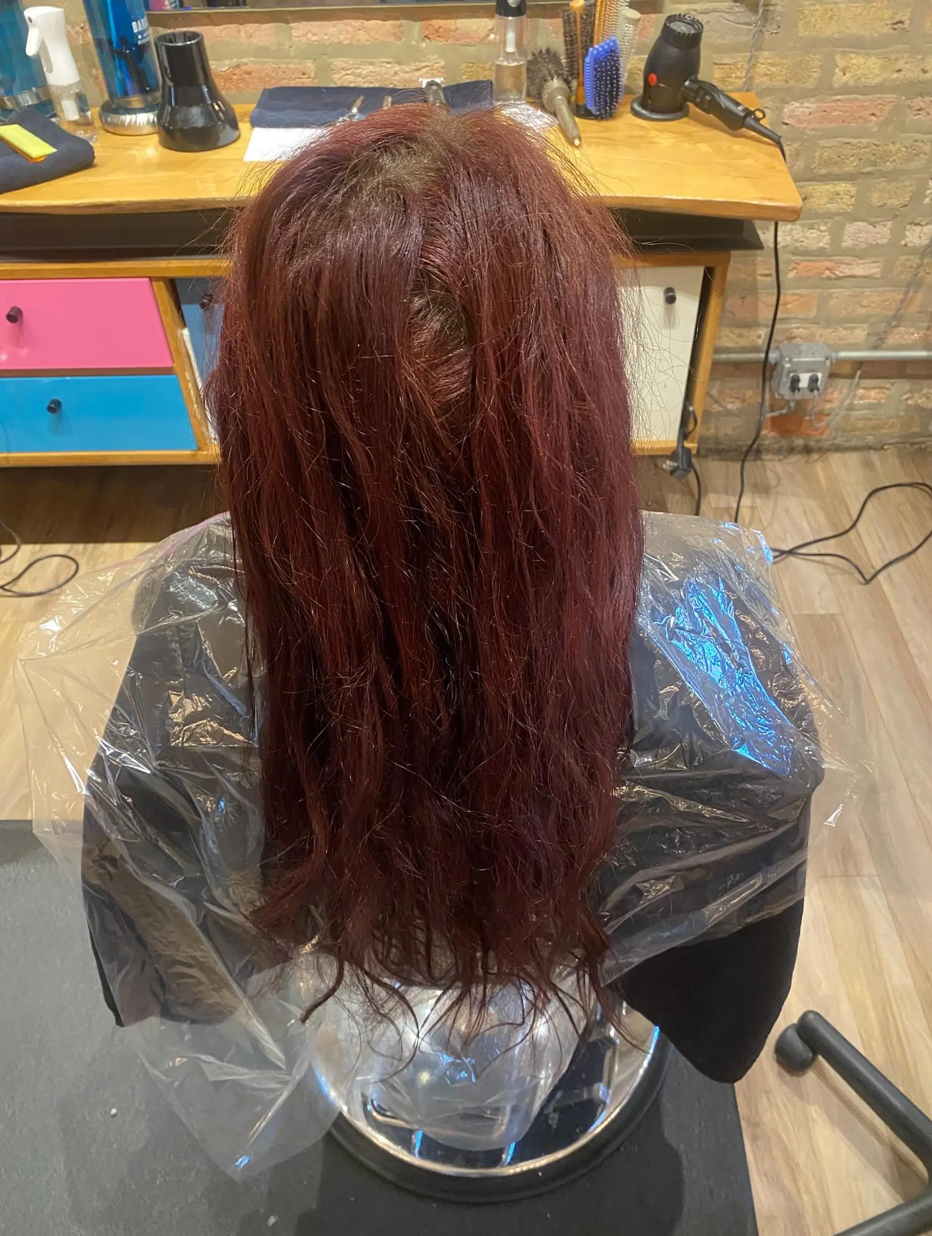 A very long, straight hairstyle with a beautiful copper red color. 2