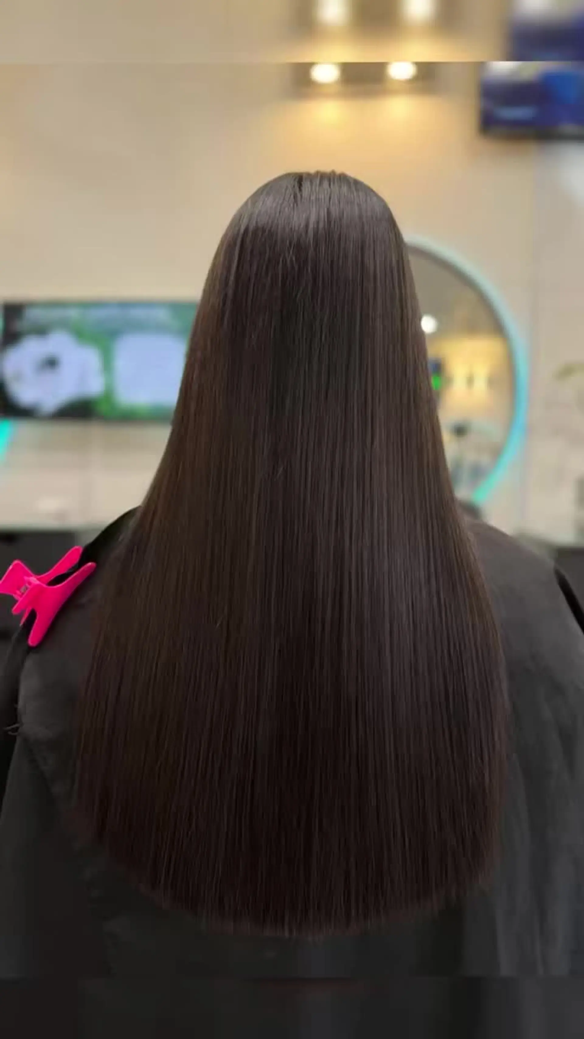 Long, pin-straight dark hair with a glossy, glass-like finish. 1