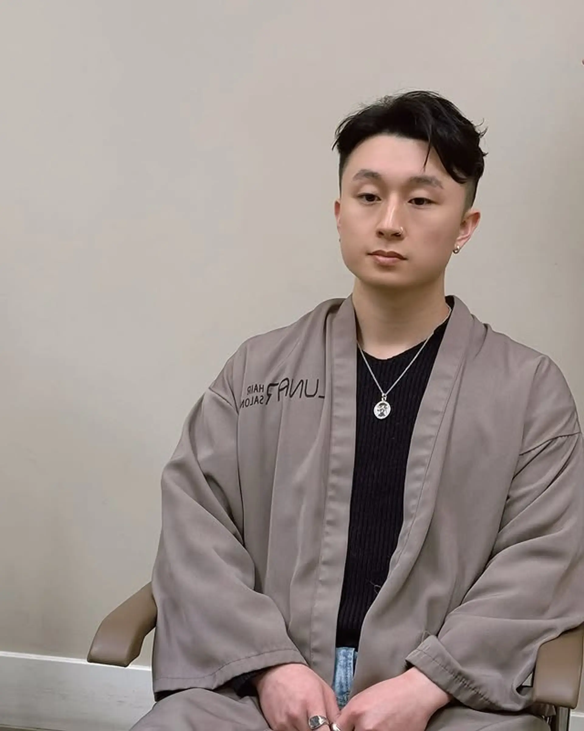 A textured, modern bowl cut with soft waves and tapered sides. 1