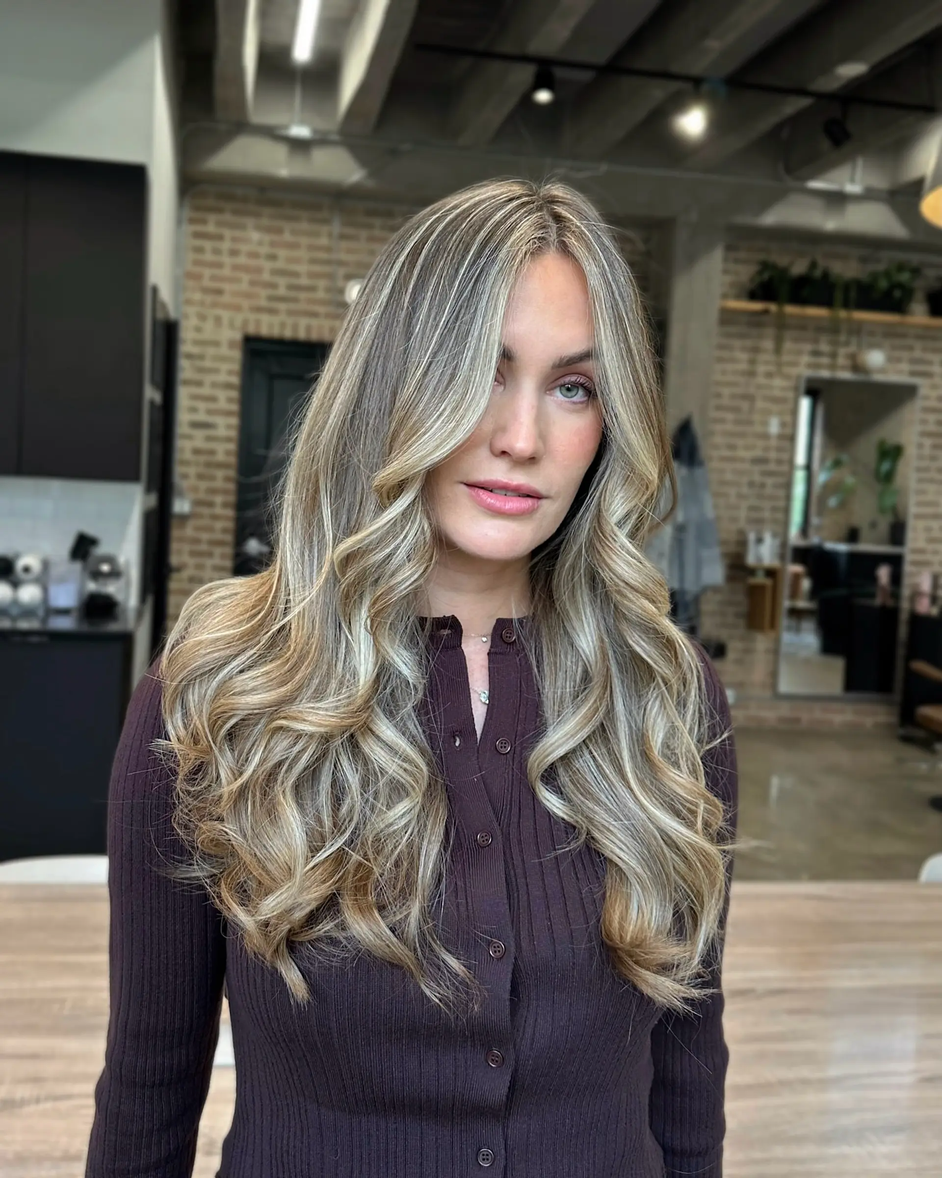 Bronde balayage with loose beach waves and face-framing layers. 1
