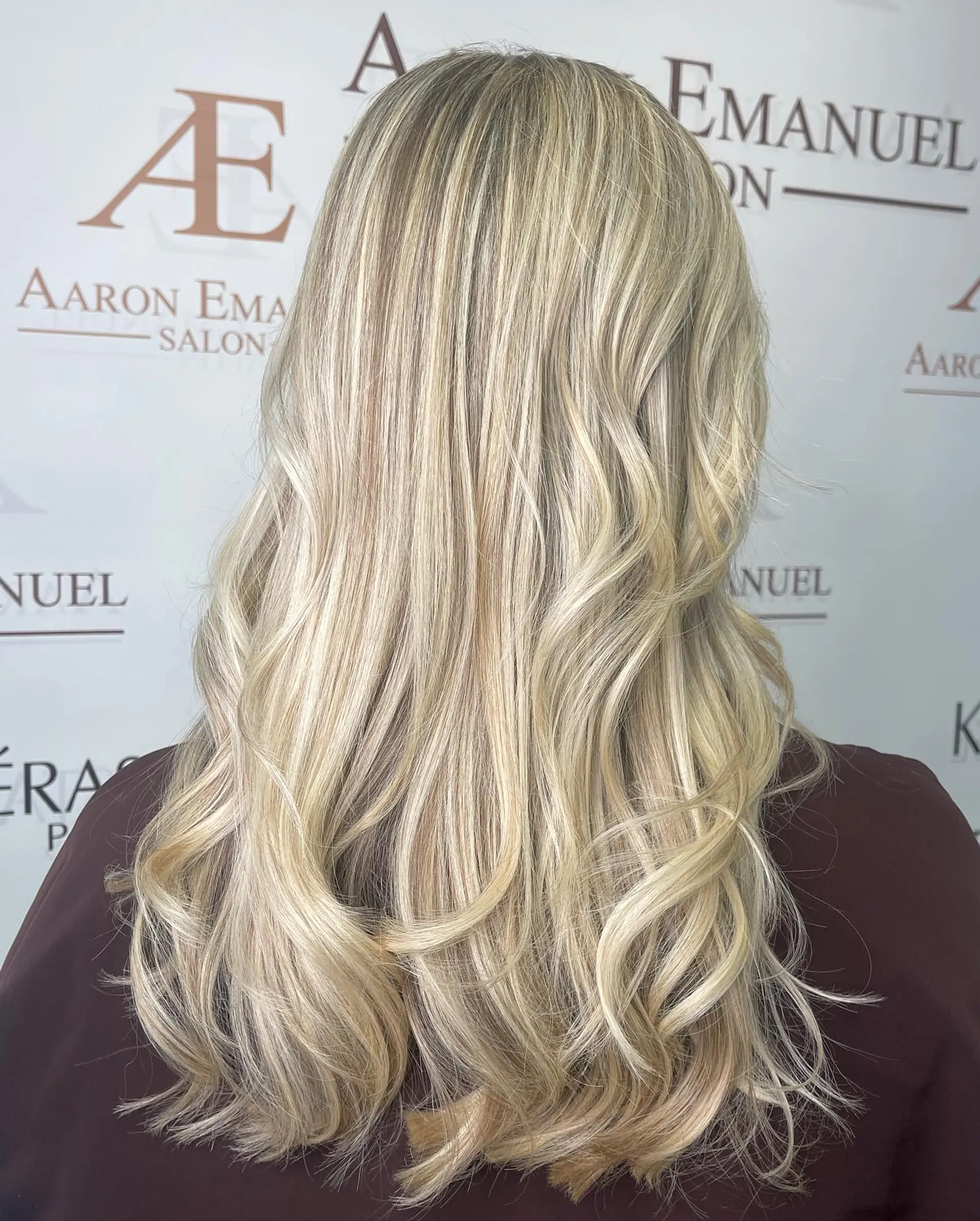 A beautiful long wavy style featuring a creamy blonde balayage. 1