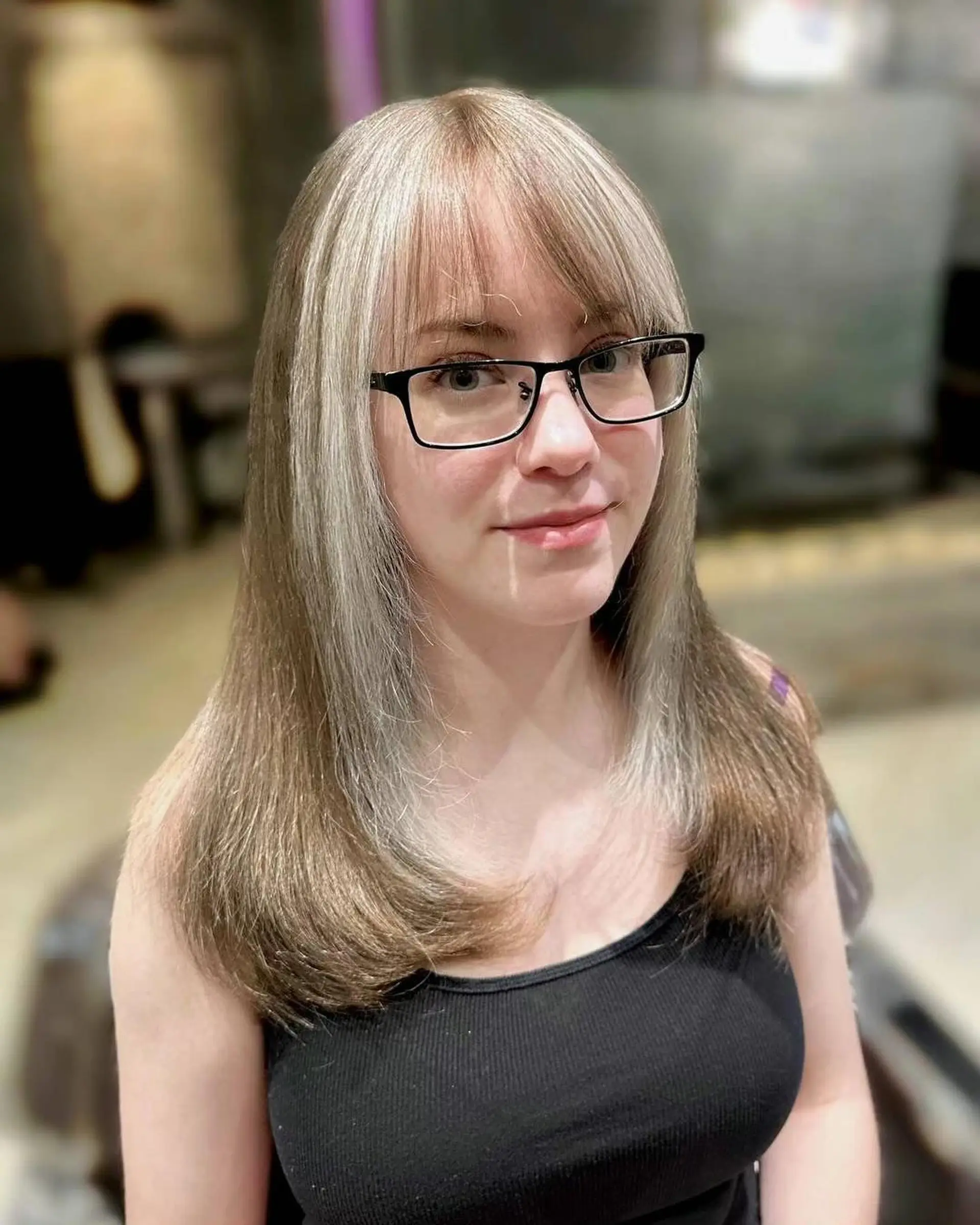 Long layered straight hair with bangs. 1