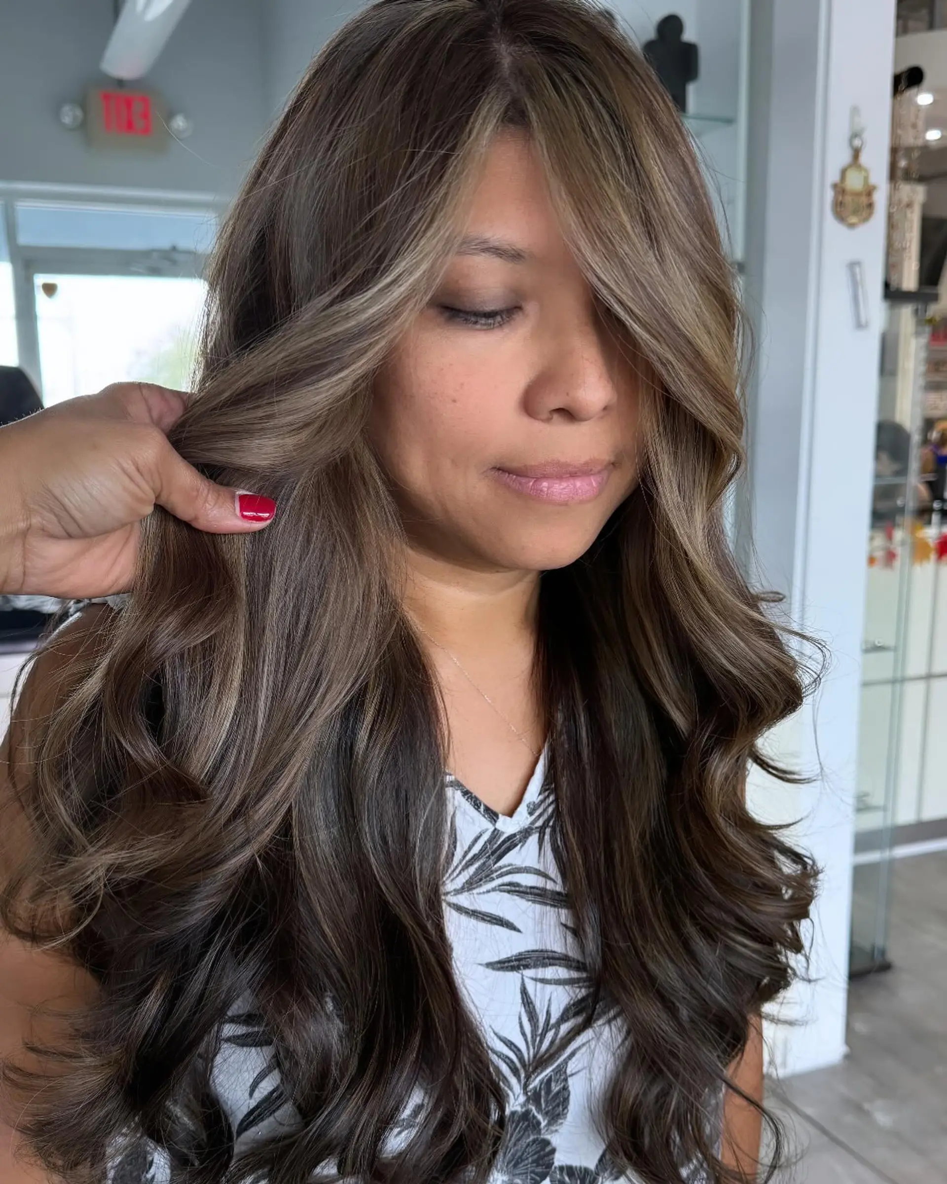 Long, flowing waves with a seamless caramel balayage for a sun-kissed effect. 1