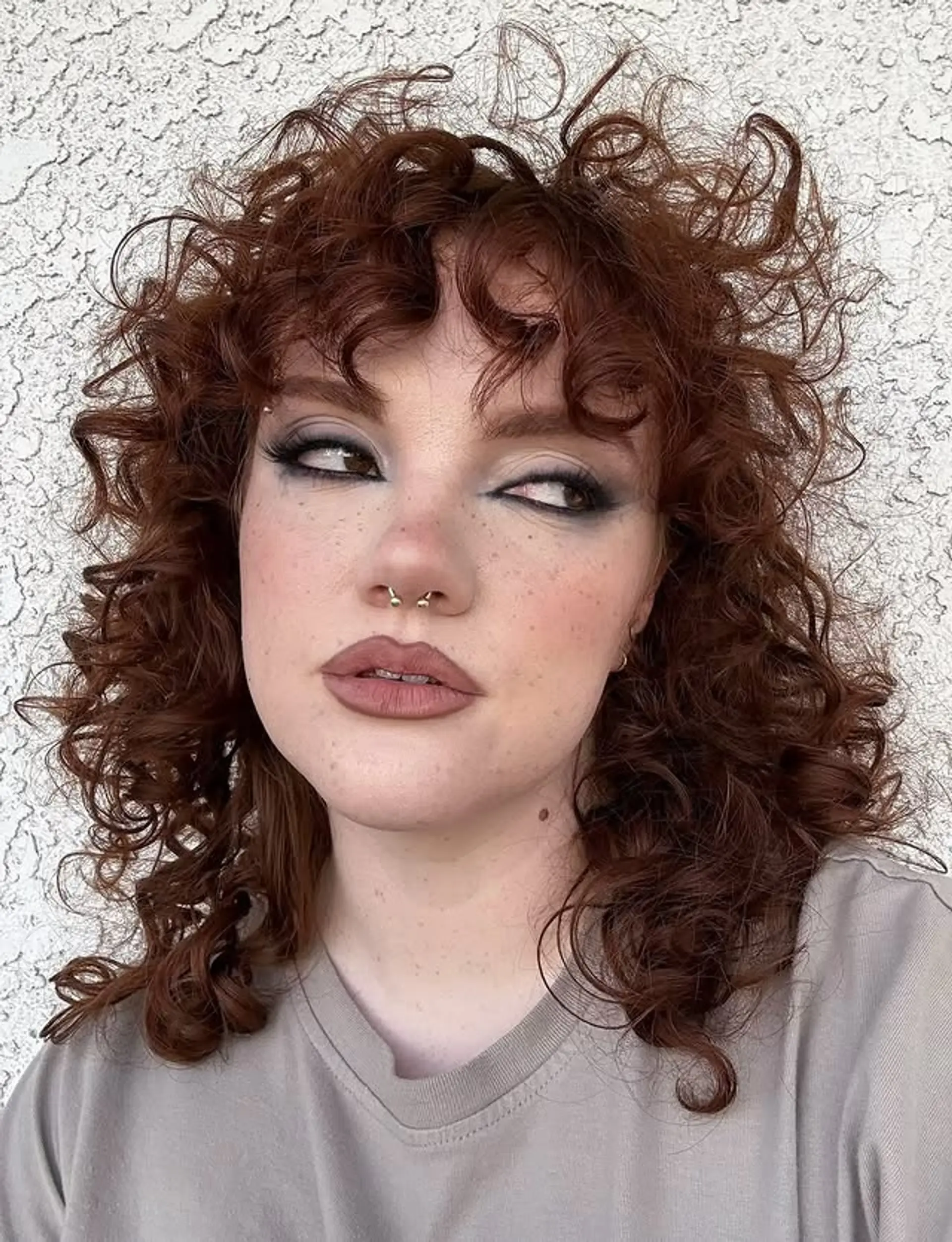A curly shag with bangs and lots of texture. 1