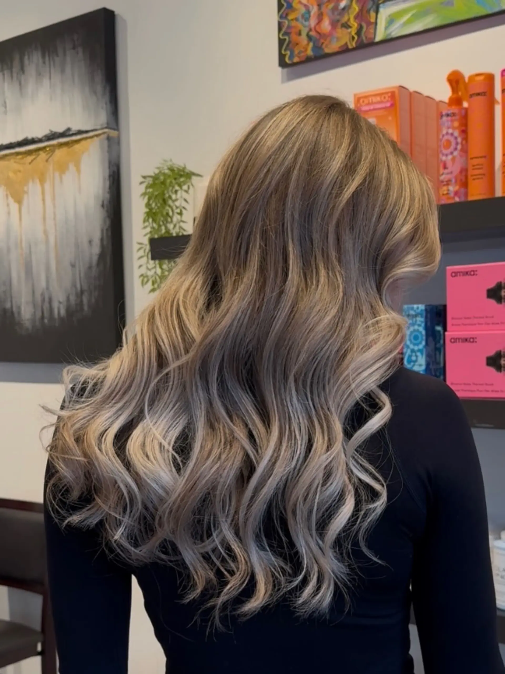 Long ash blonde balayage styled into cascading soft waves. 1