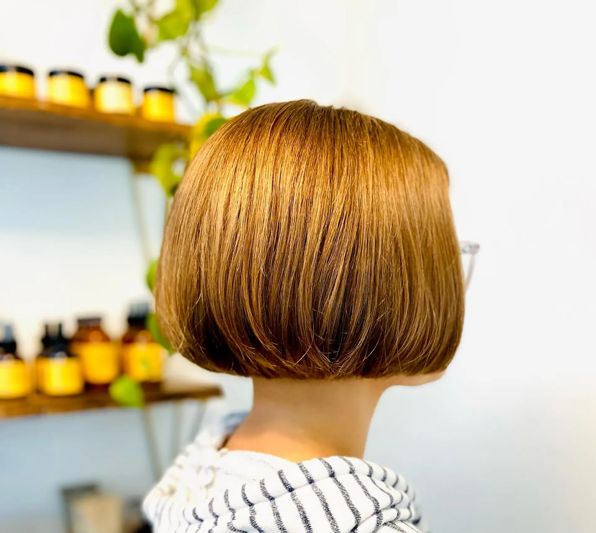 A precision chin-length classic bob with blunt edges curled gently under. 1