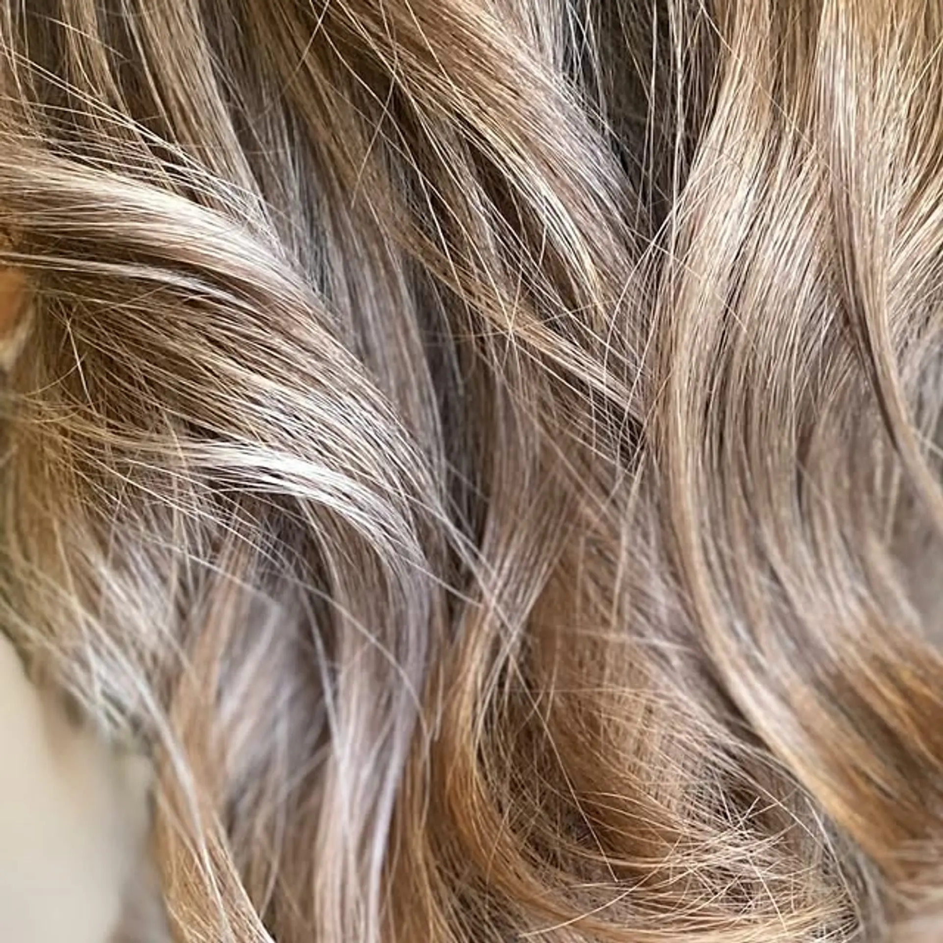 A bronde balayage with soft, tousled waves for a dimensional and natural look. 1