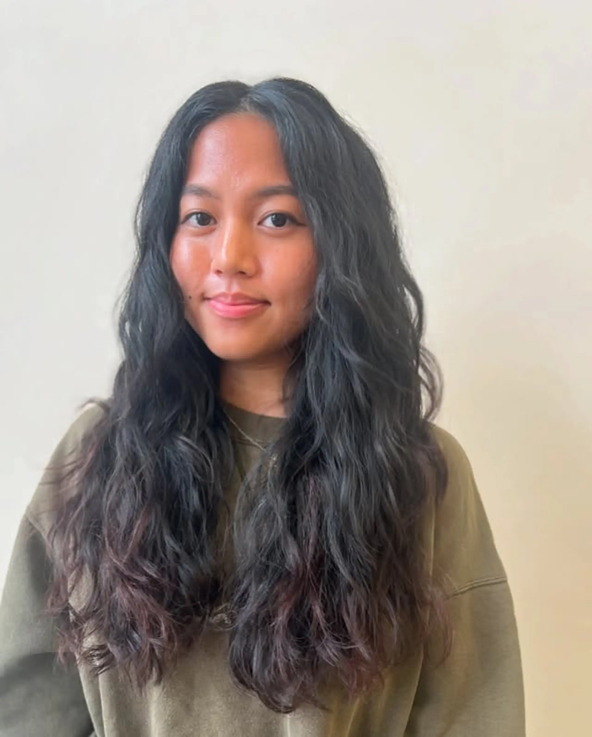 Long, wavy hair with a subtle ombre color effect. 1