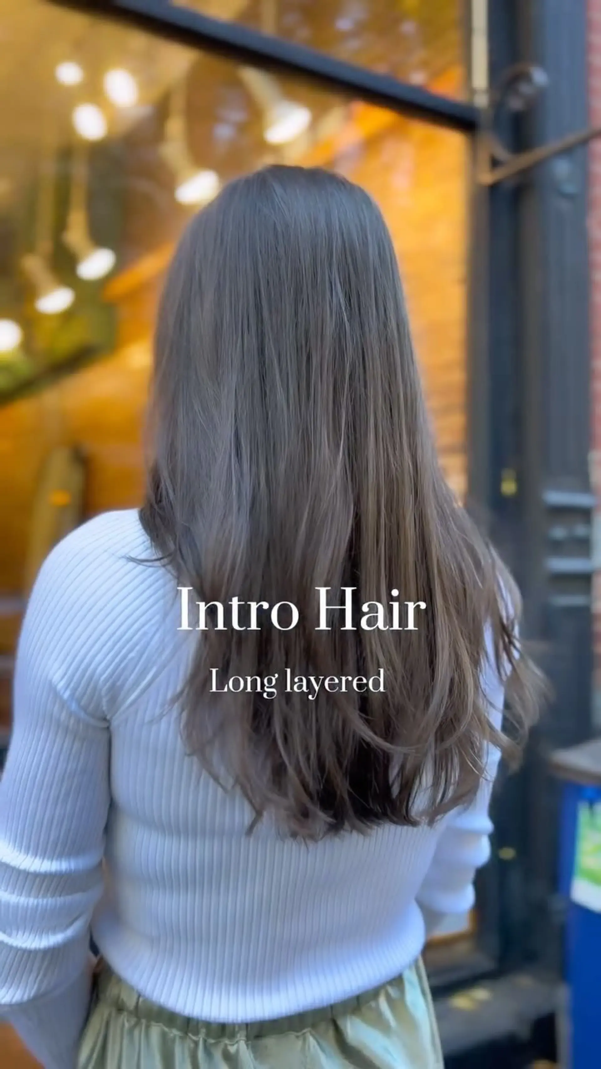 Long cool ash brown hair featuring soft, blended layers and gentle movement at the ends. 1