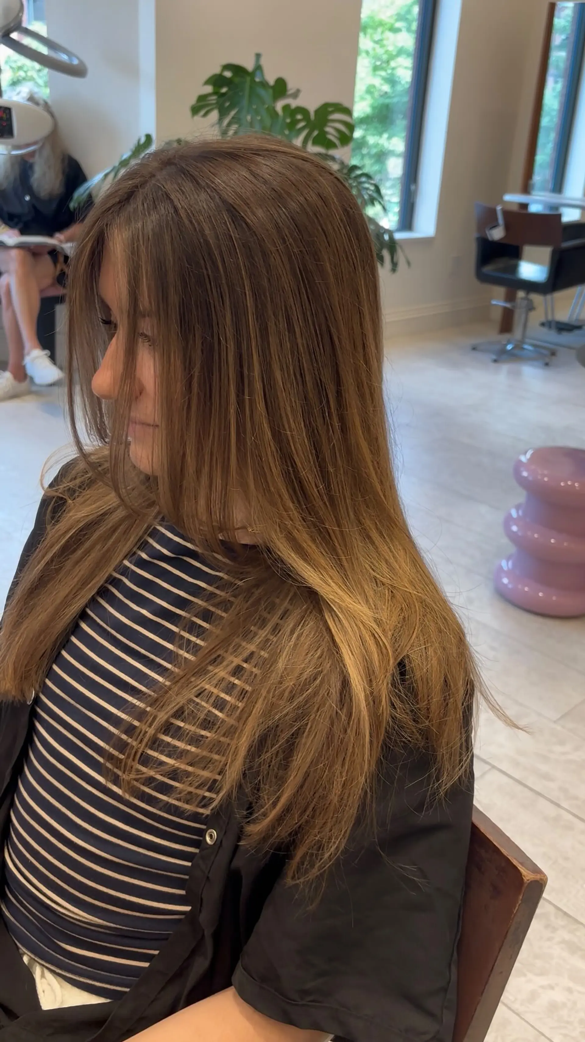 Straight, smooth long bronde hair cut with soft face-framing layers and a high-shine finish. 1