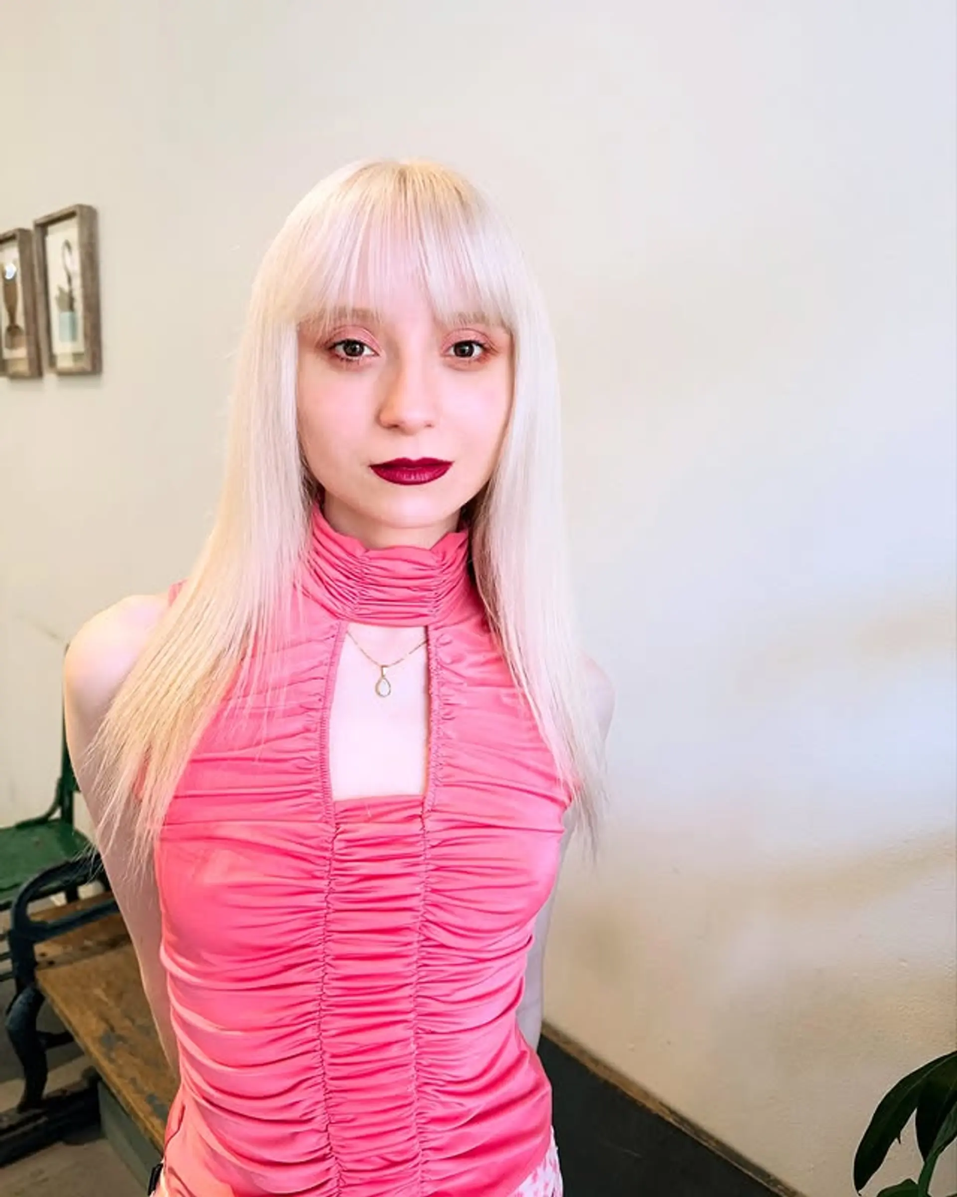 Long, straight hair with blunt bangs. 1