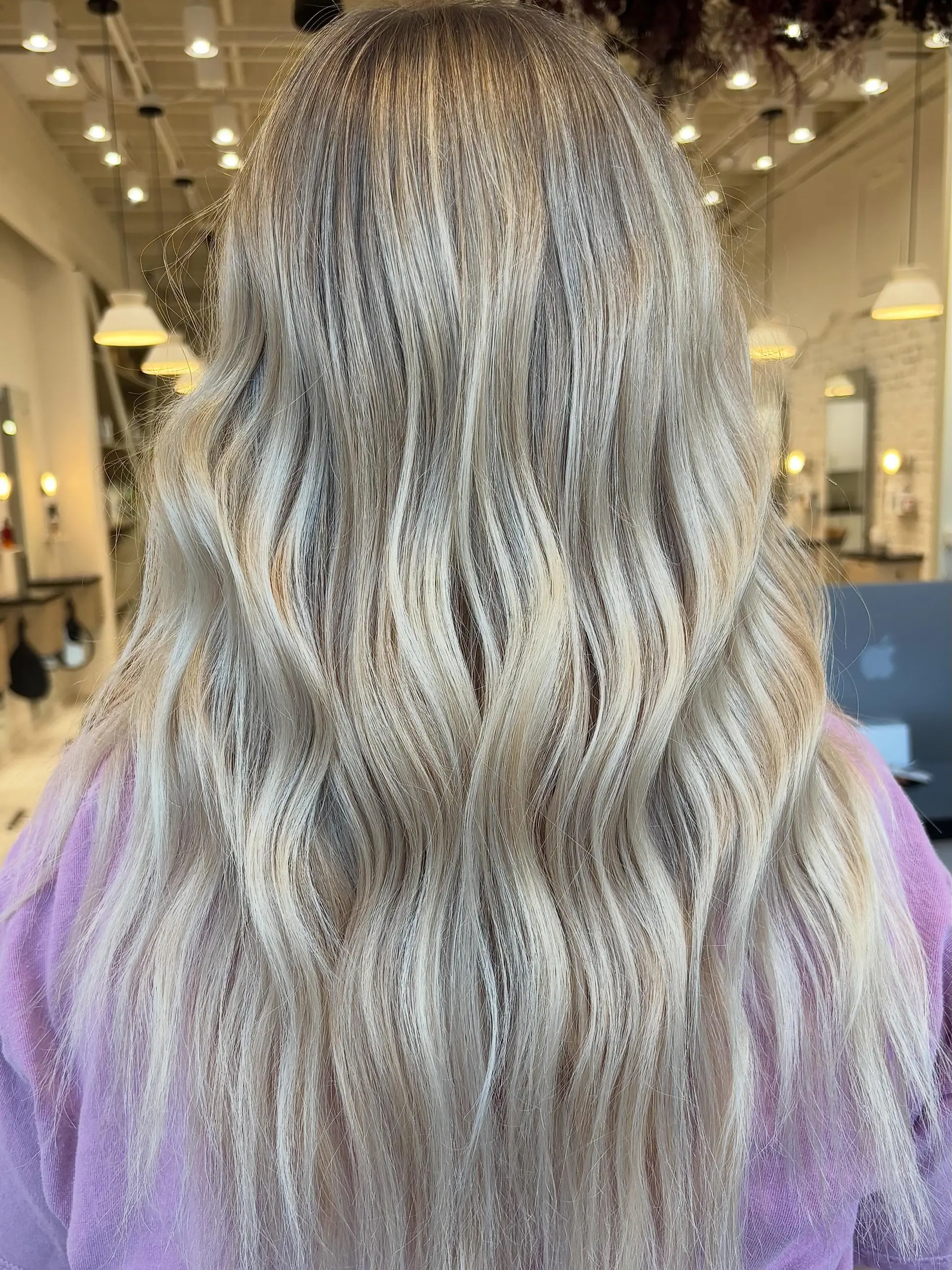 Long blonde hair featuring dimensional highlights styled into loose, gentle waves. 1