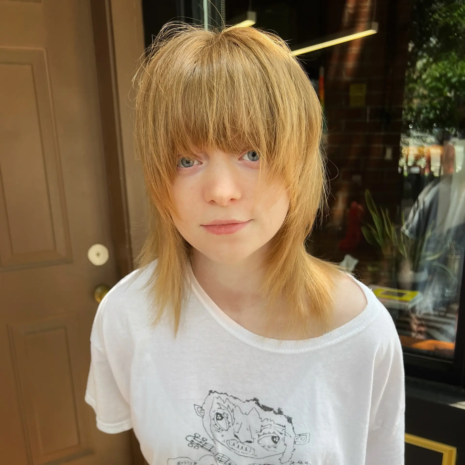 A straight, razor-cut shag featuring heavy textured fringe, soft face-framing layers, and shoulder-grazing length. 1