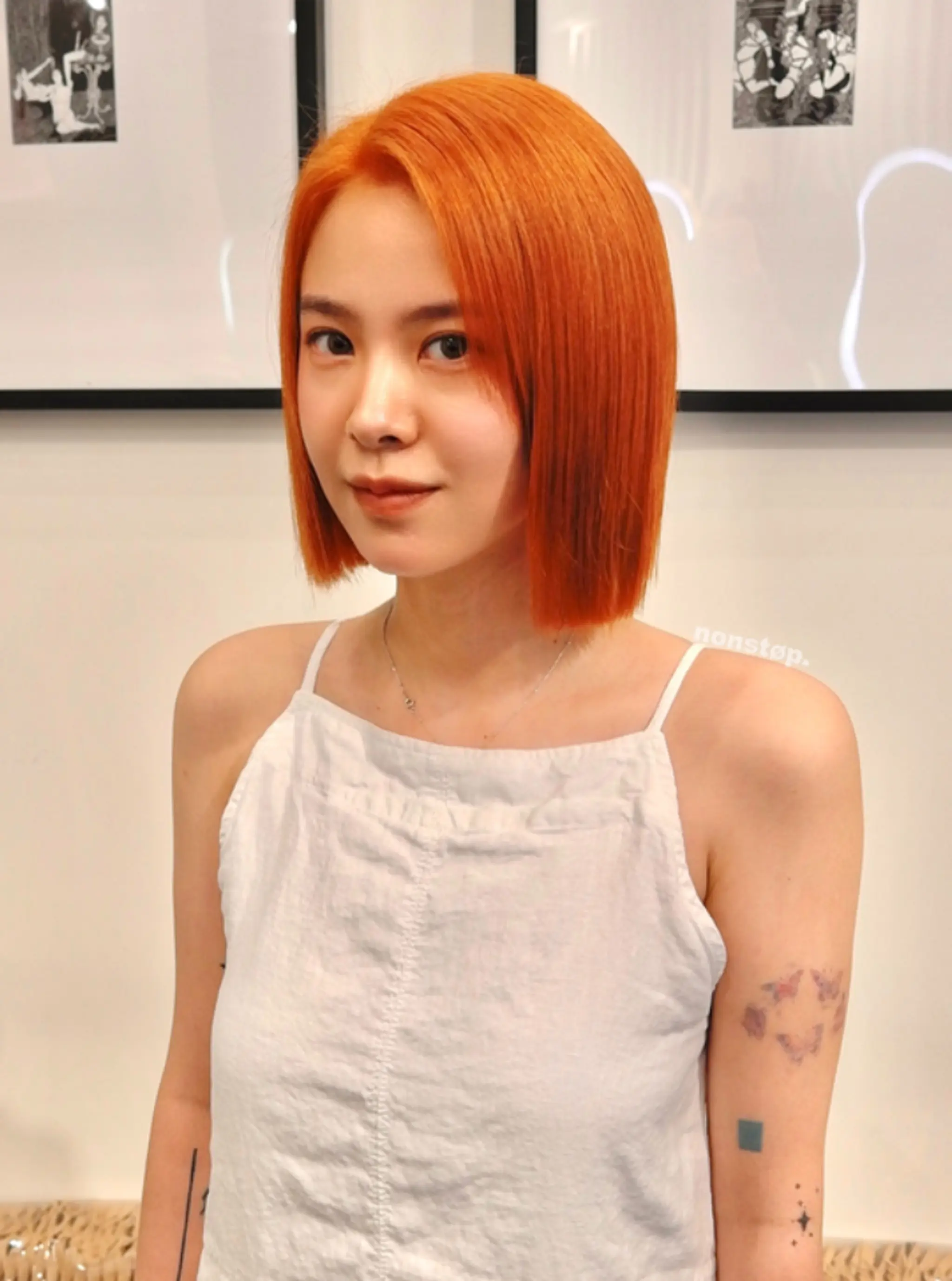 A sleek and smooth blunt bob haircut with a middle part, characterized by a vibrant copper-orange color. The hair is of medium length, cut precisely to sit just above the shoulders, with a shiny and polished appearance.

(NonstopStyle: by Hiro) 1