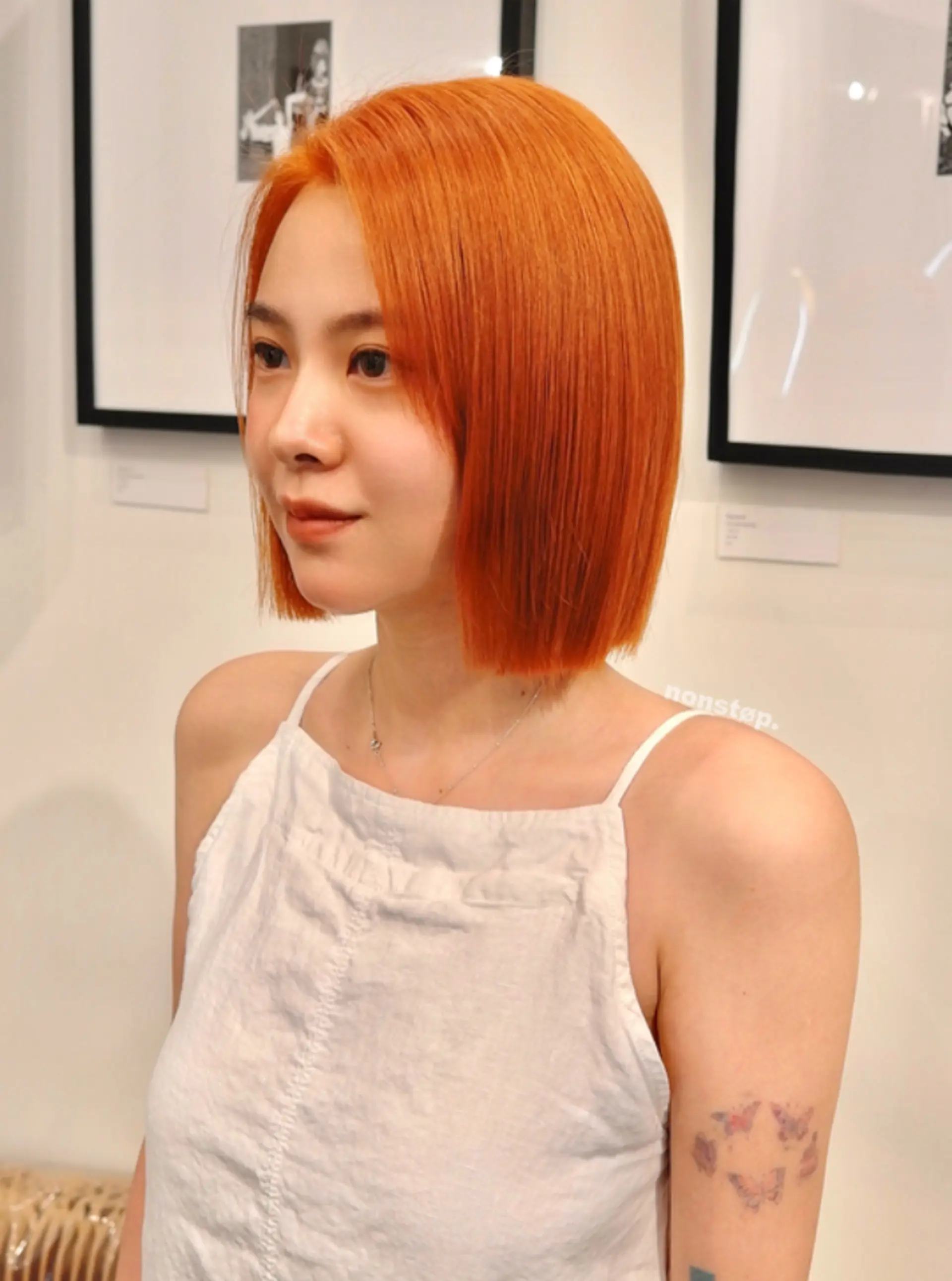 A sleek and smooth blunt bob haircut with a middle part, characterized by a vibrant copper-orange color. The hair is of medium length, cut precisely to sit just above the shoulders, with a shiny and polished appearance.

(NonstopStyle: by Hiro) 2