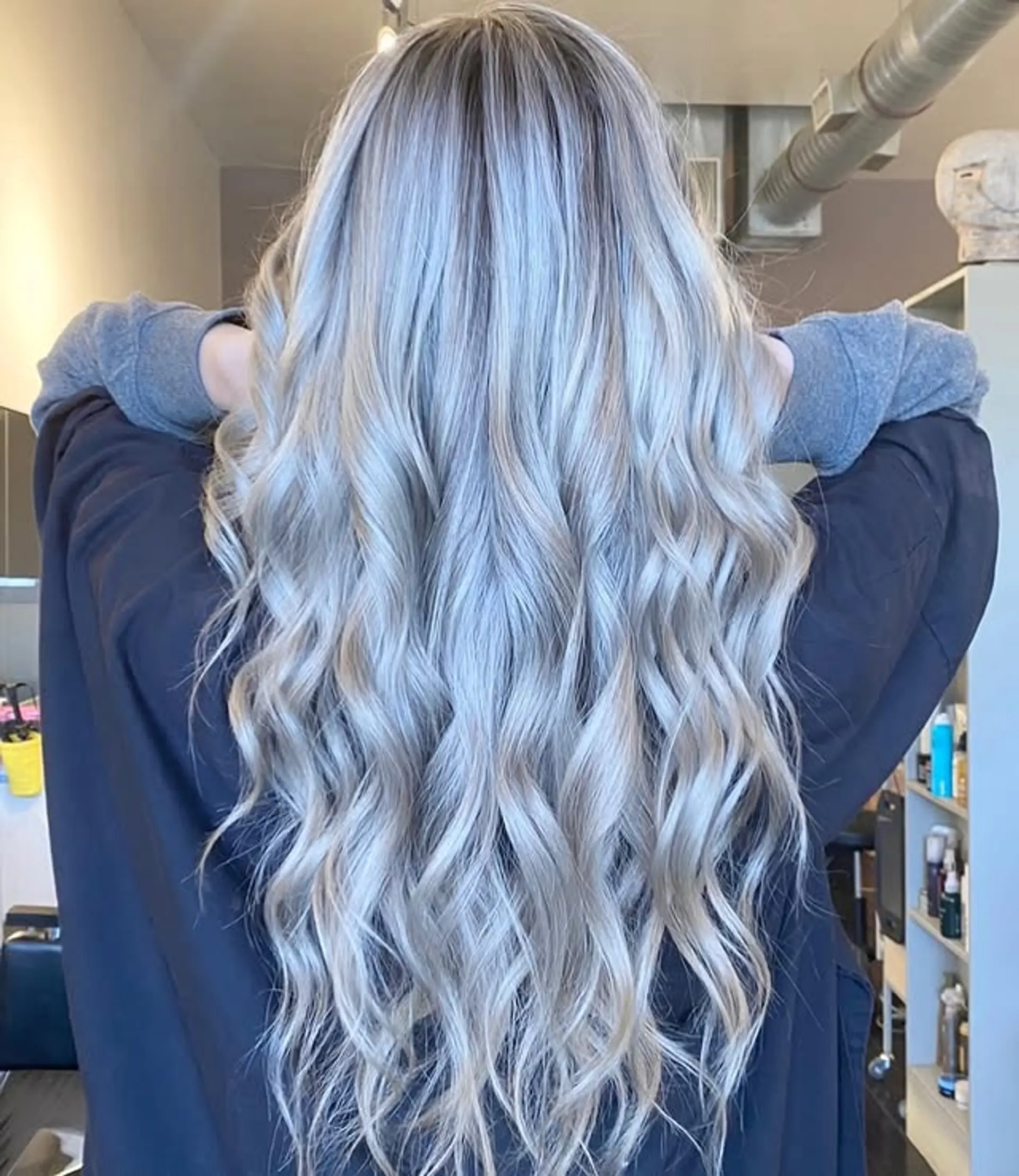 Long wavy hairstyle with icy blonde, silver, and ash blonde balayage. 1