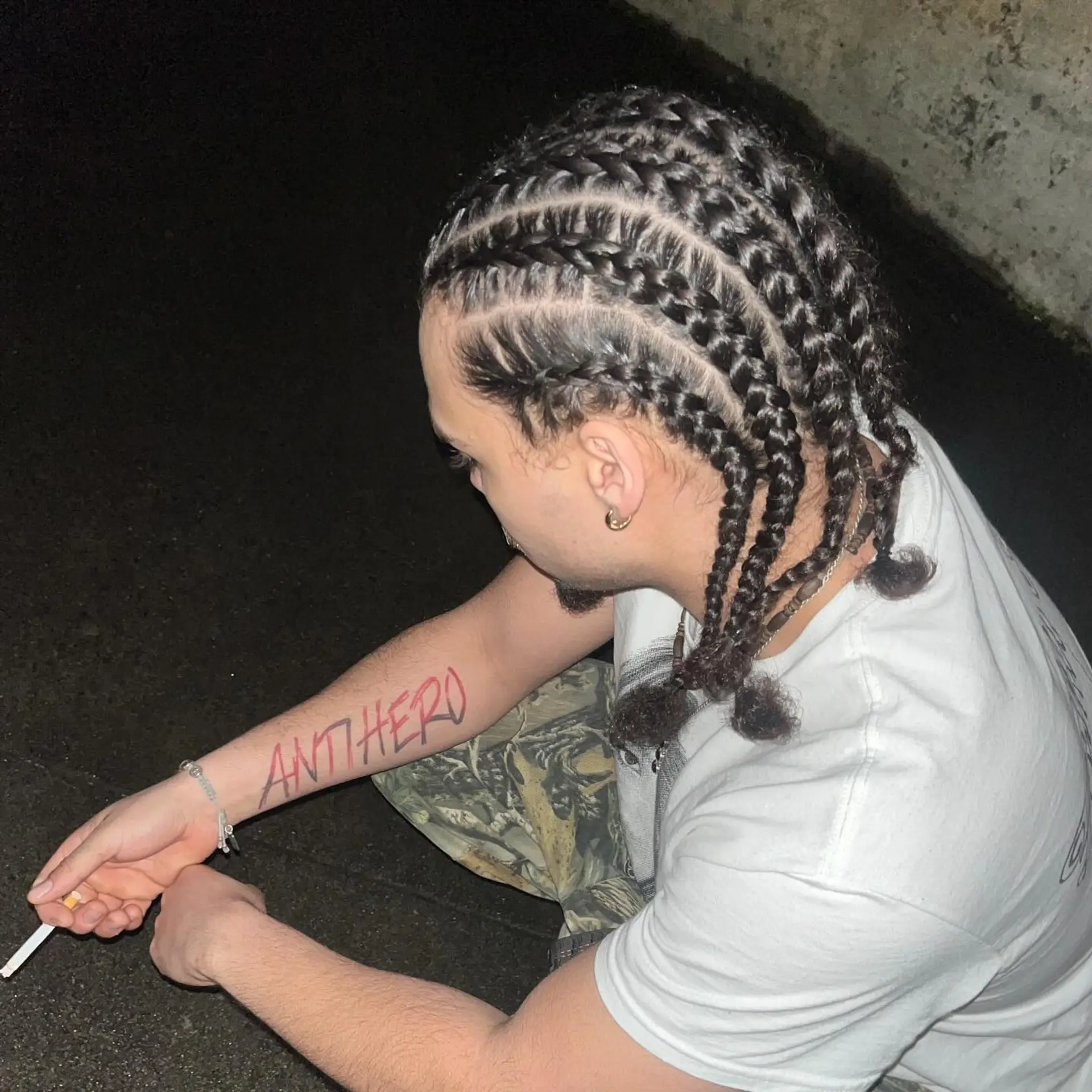 Clean straight-back cornrow braids extending from the front hairline to the nape with defined, neat partings. 1
