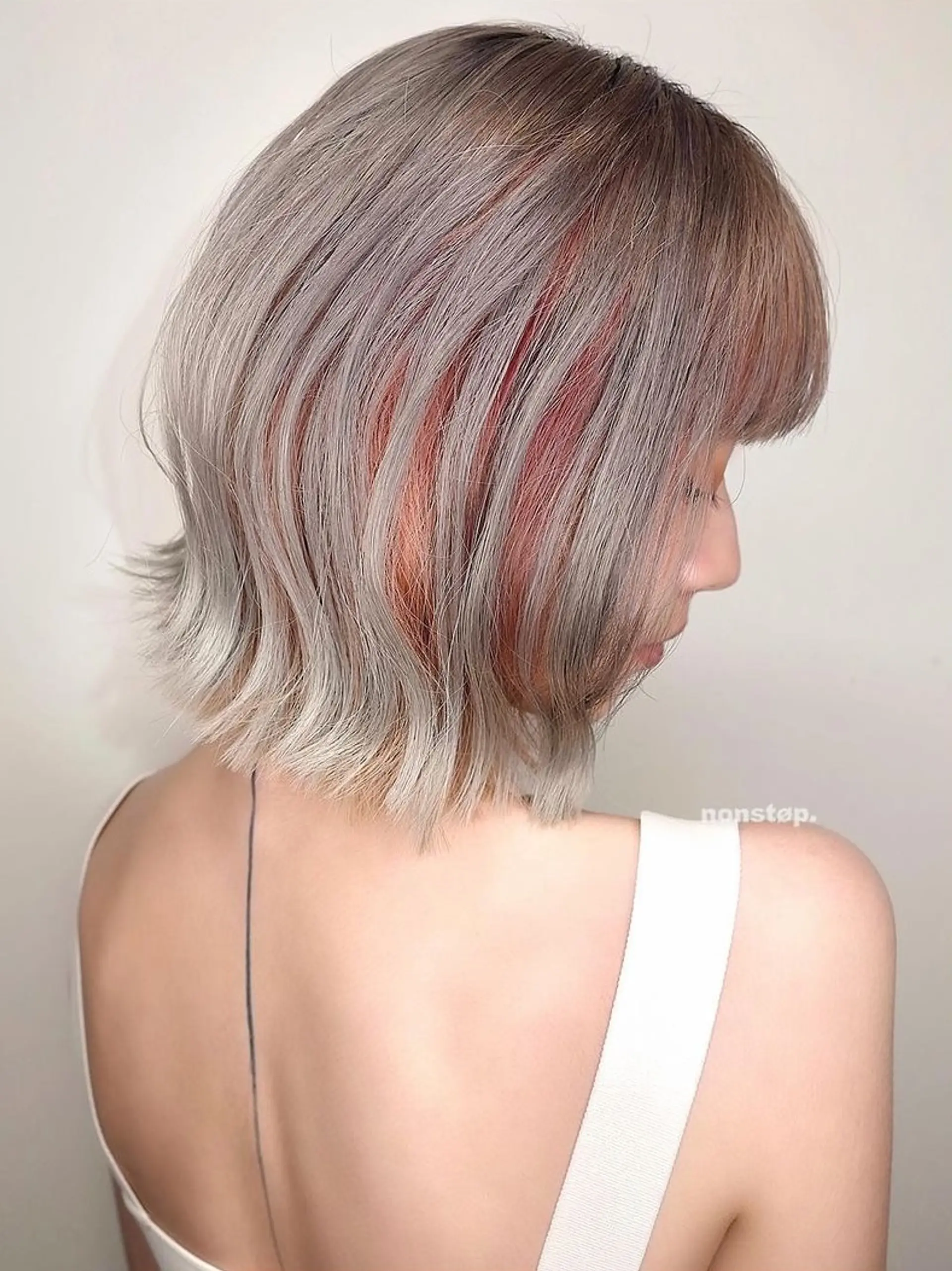 A stylish short bob featuring straight textures with straight bangs, two-toned copper and grey hues blending into black roots, and subtly angled ends framing the face. 🌄 Sunset girl by HIRO 2