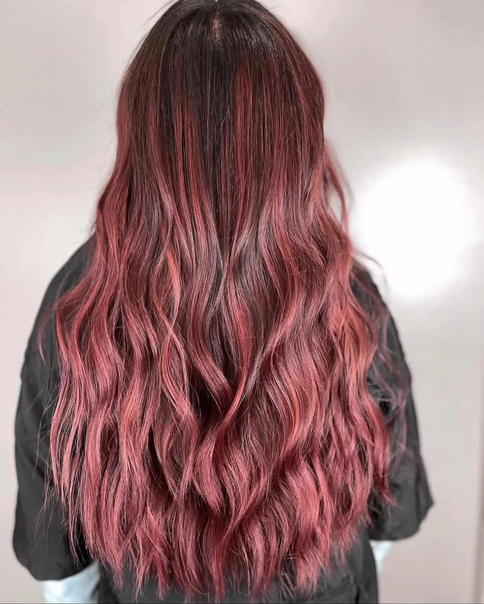 A stunning rose gold ombre on long, wavy hair. 1