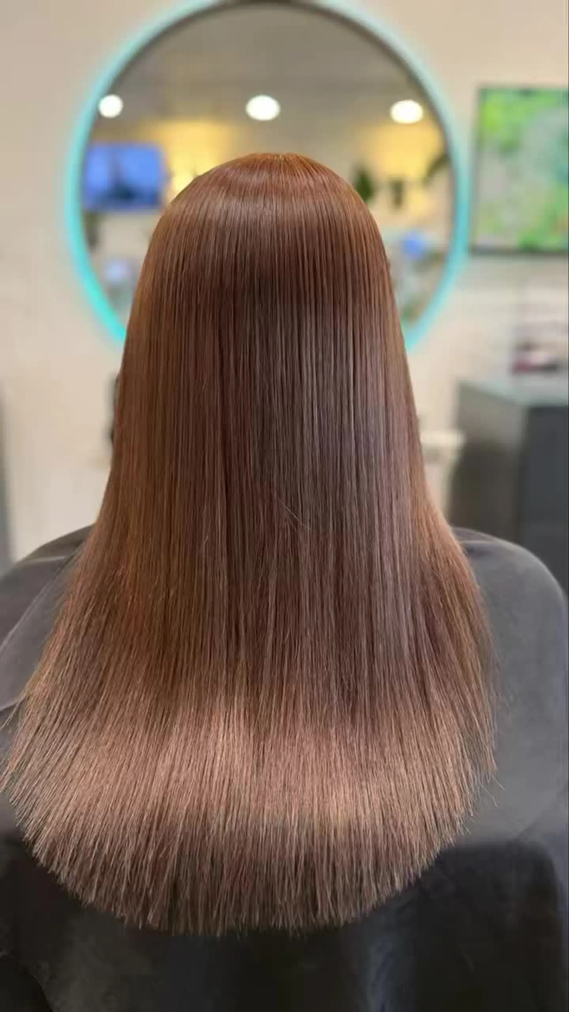 Ultra-sleek, pin-straight long hair with a smooth, glossy finish and healthy shine. 1