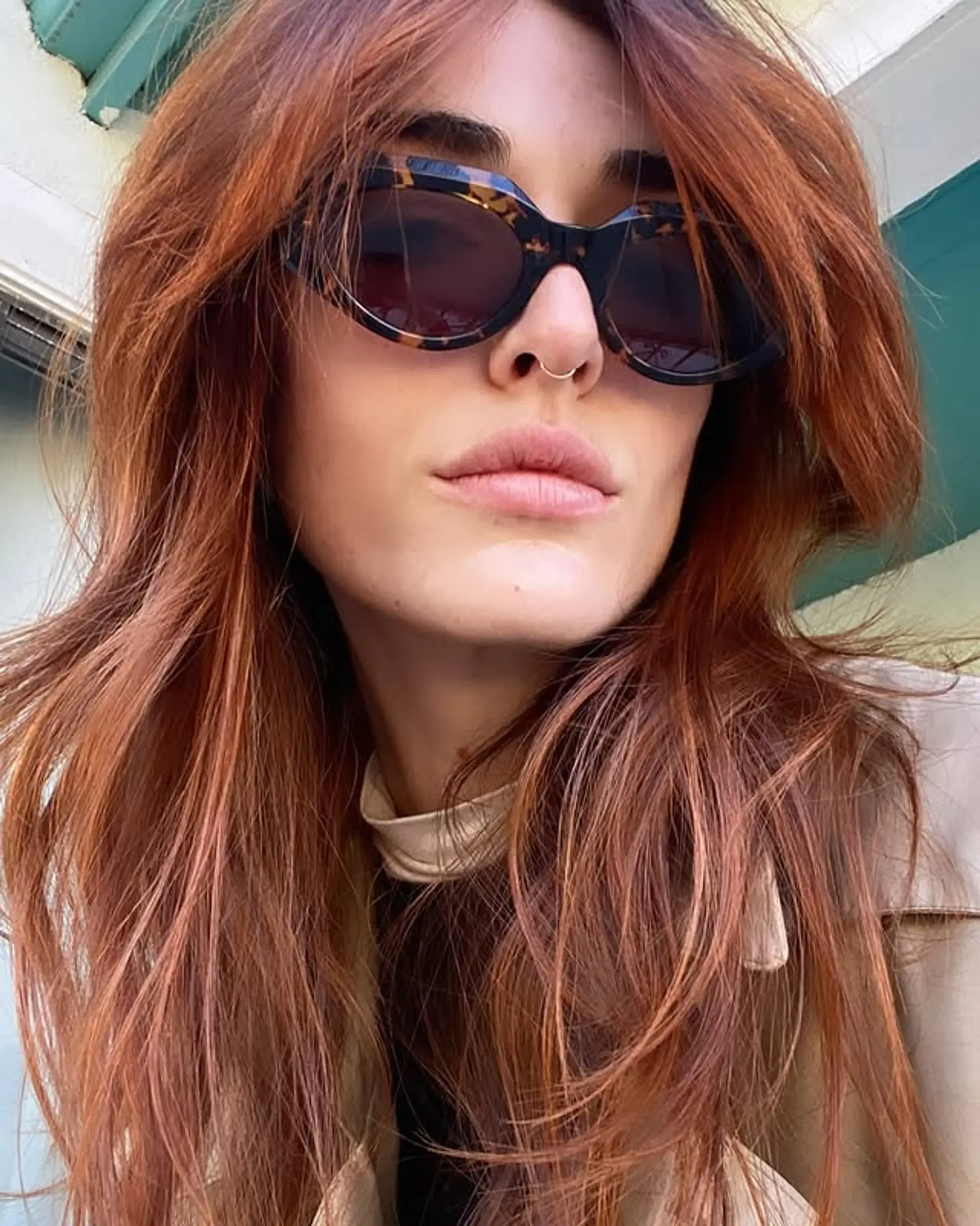 A stunning long layered haircut with a vibrant copper red bronde color. 1