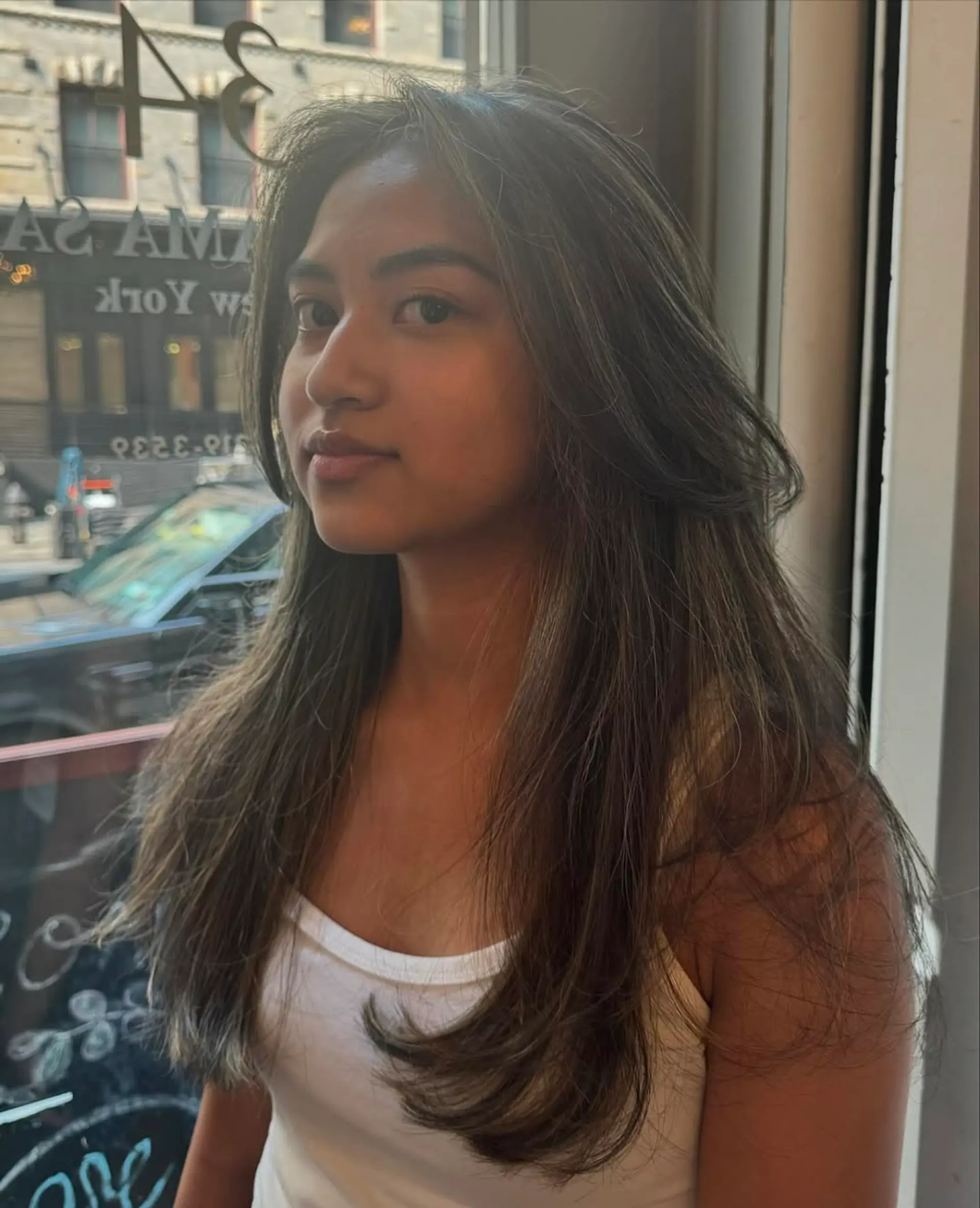 Long, straight, dark brown hair with ash blonde highlights, layered for volume with a sleek finish. 5