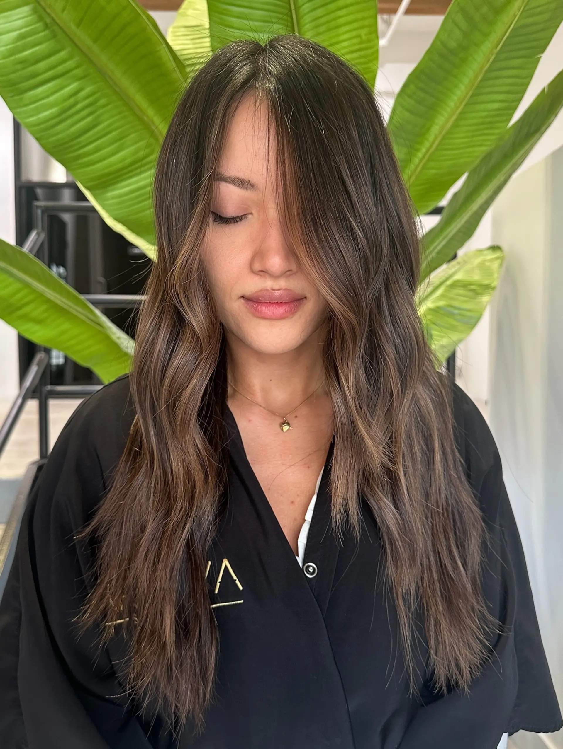 Long wavy hair with face-framing layers and a balayage color effect. 1