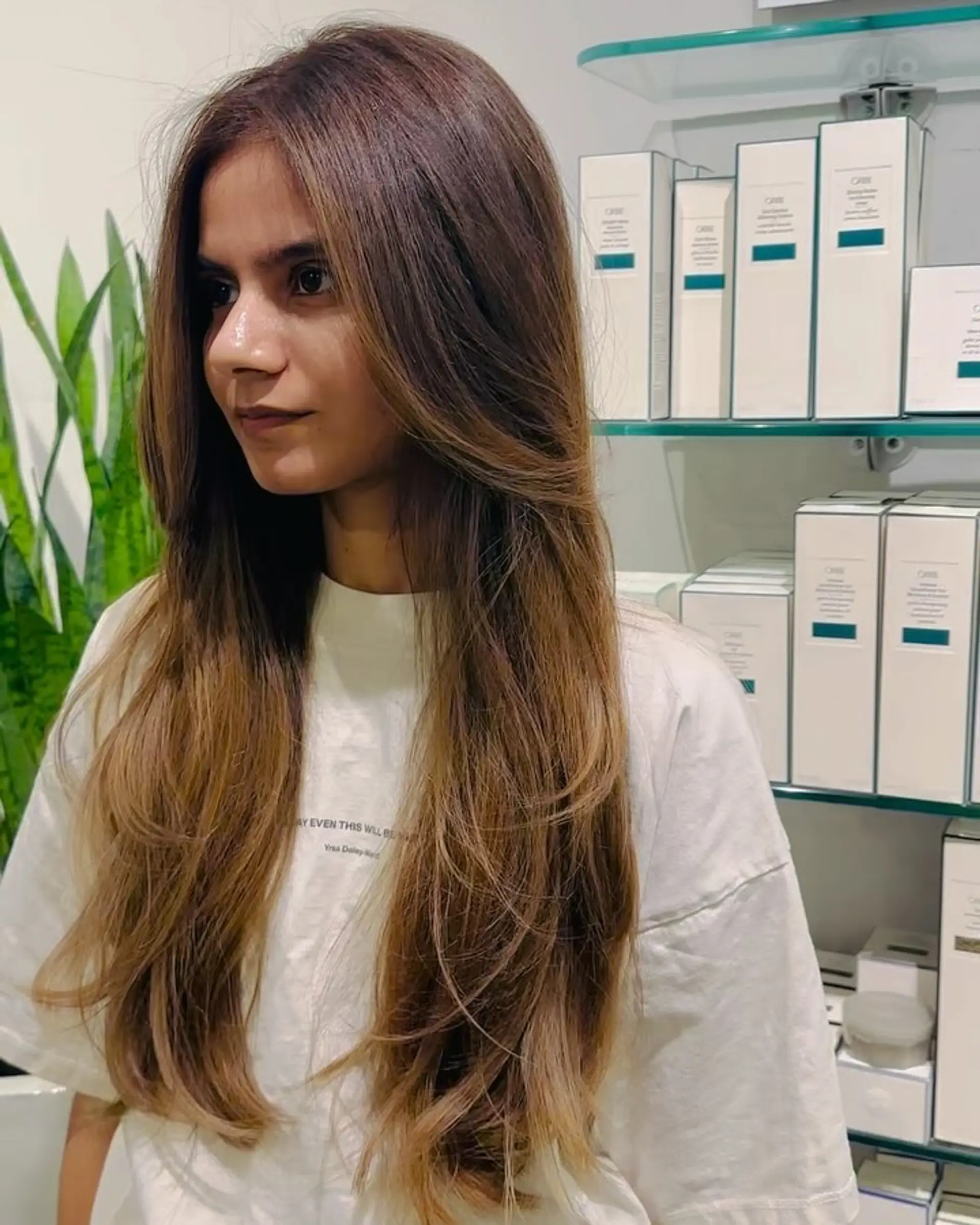 Long brunette hair featuring face-framing long layers and styled with a smooth, soft blowout. 1