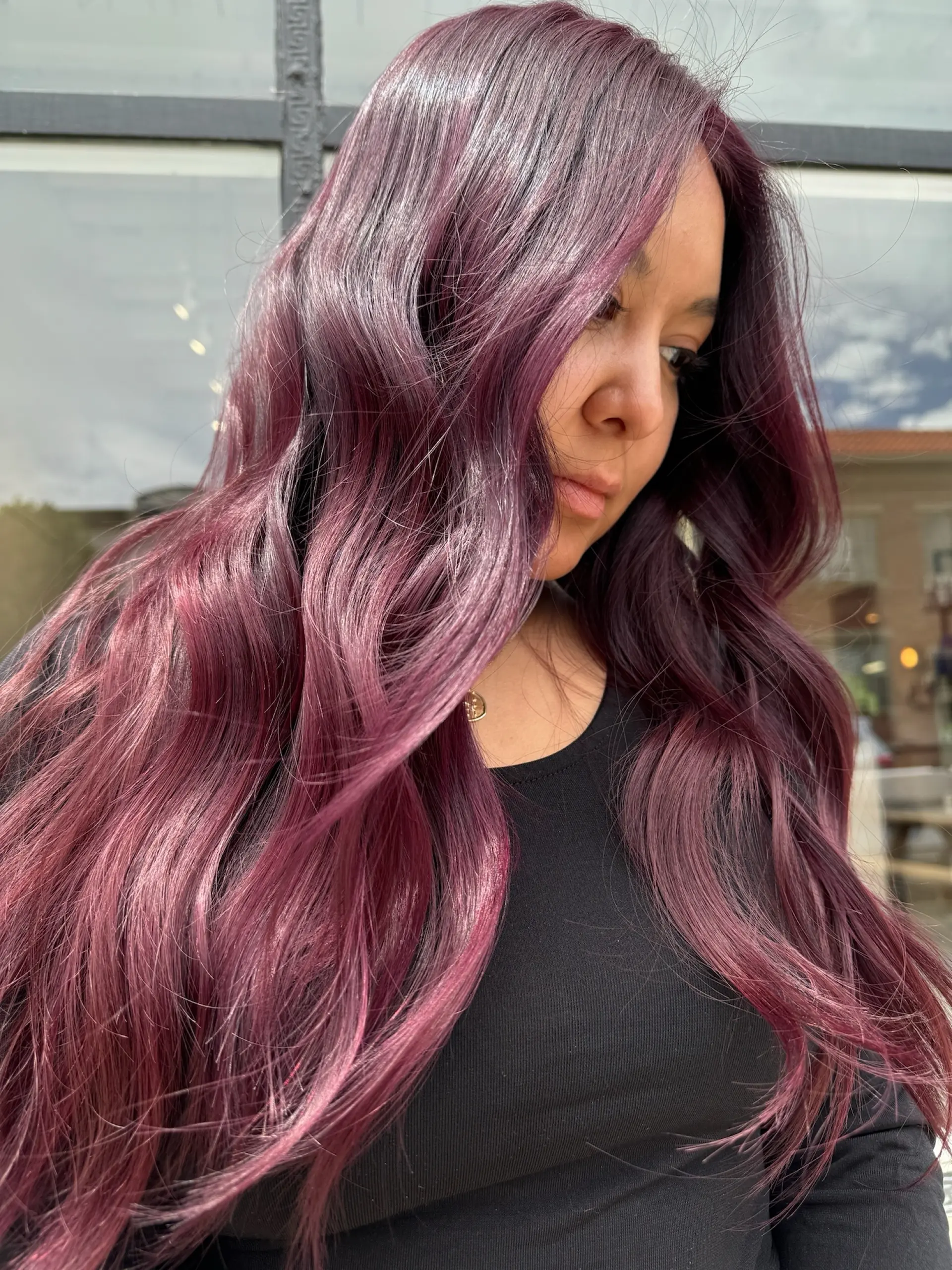 Long cascading hair featuring deep plum and magenta tones, styled into loose, glossy waves. 1