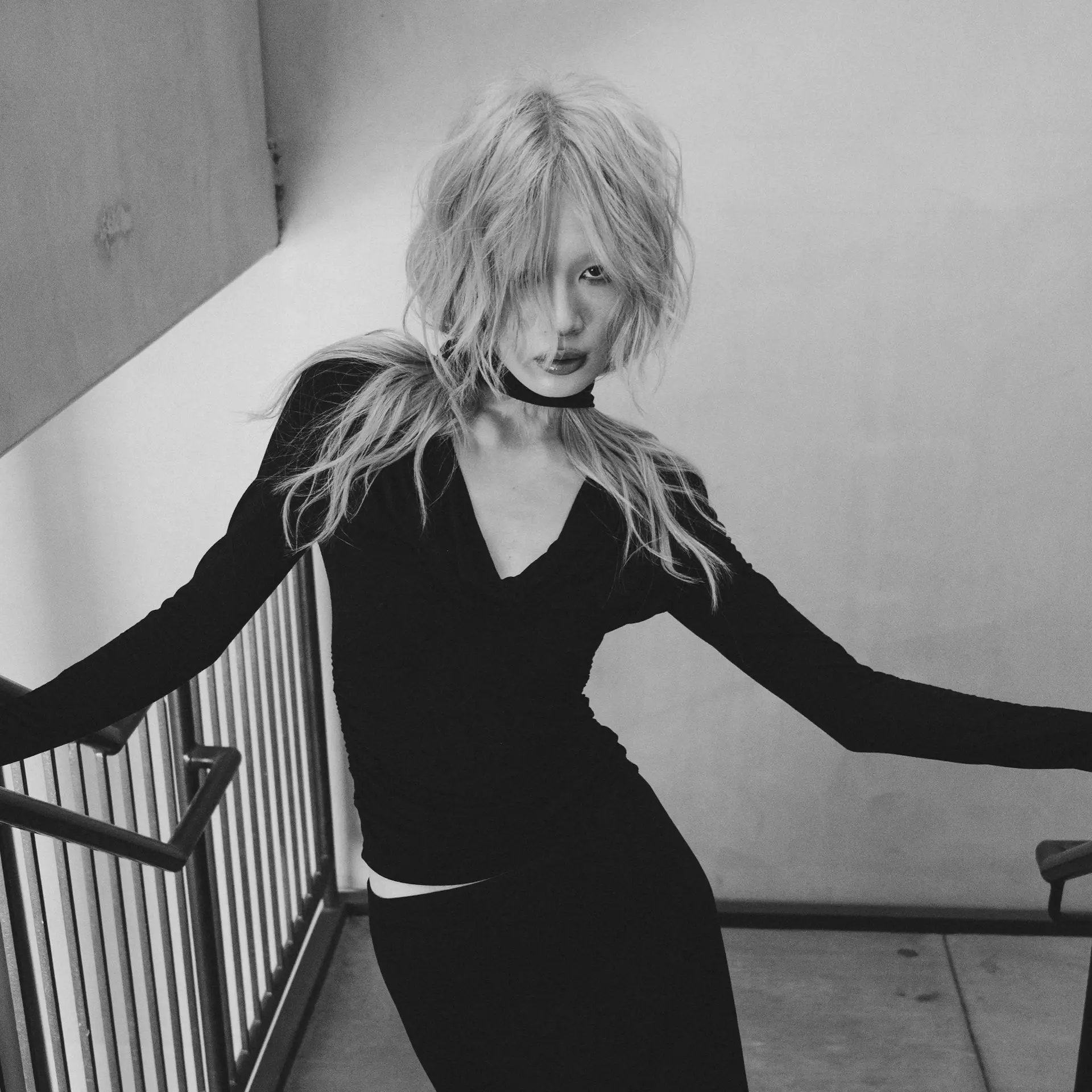 A heavily textured shag haircut featuring choppy, tousled layers and long, face-covering fringe. 1