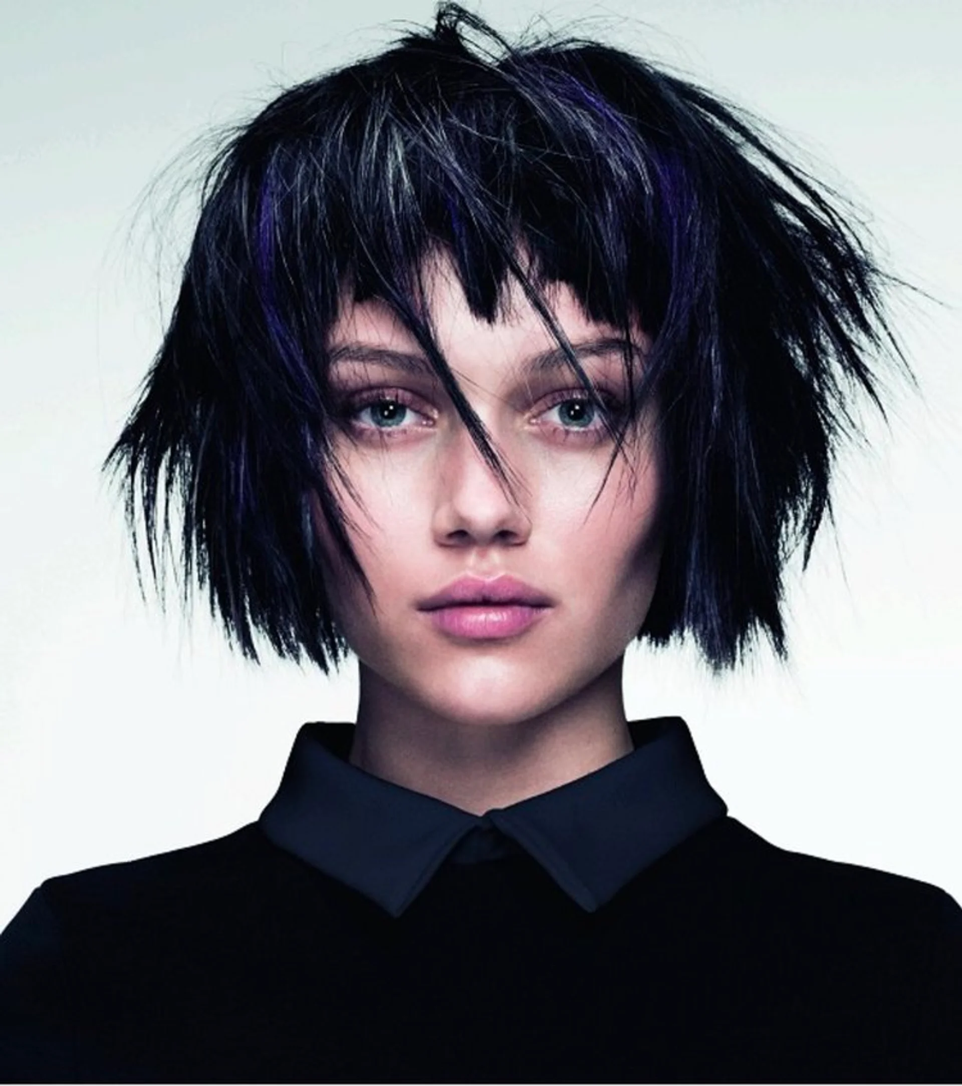 Woman with a sleek, edgy blunt bob haircut, a prominent 2025 hairstyle trend. - Preview 2