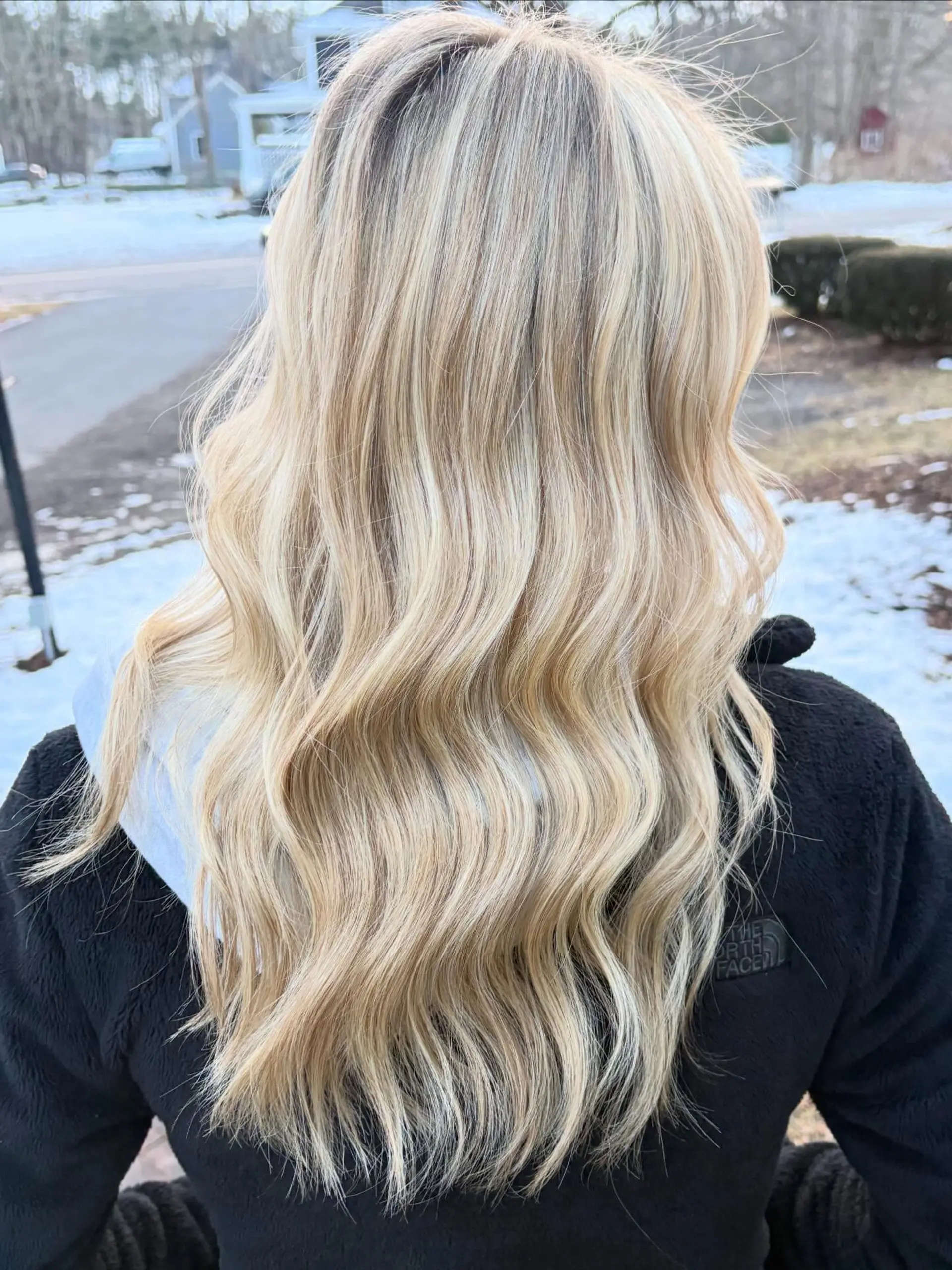 Long hair featured in soft, textured waves with vibrant dimensional blonde highlights. 1