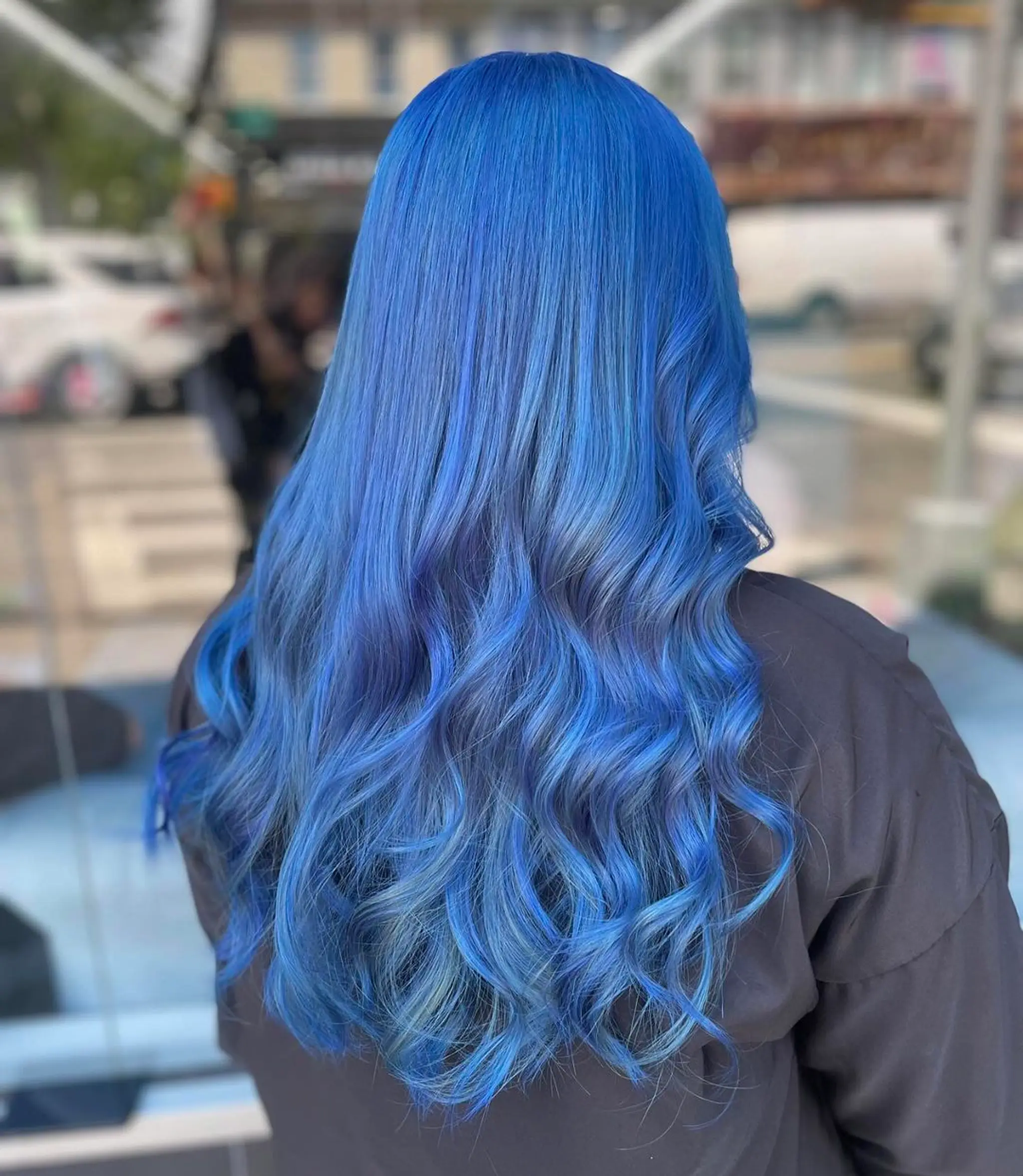 Long, wavy hair with a gradient effect of blue hues, styled in relaxed, loose waves and a layered cut, featuring a glossy finish.
Stylist - @xcellent_jason 2