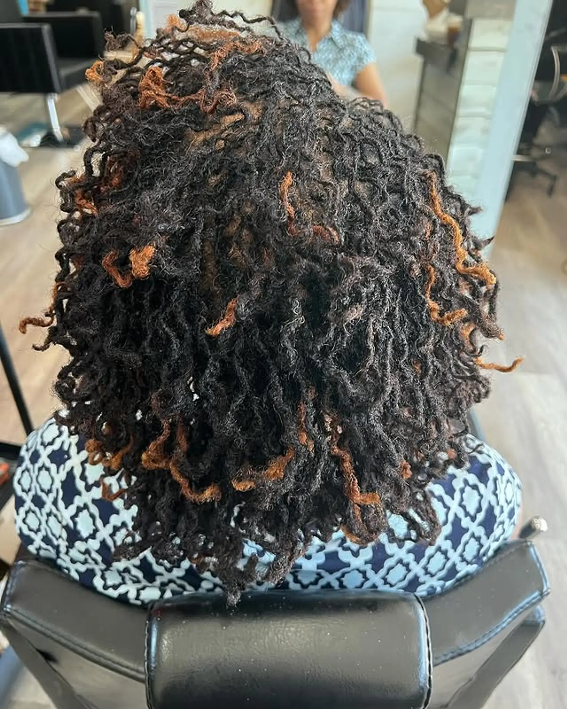 A full head of Sisterlocks with copper highlights for added dimension. 1