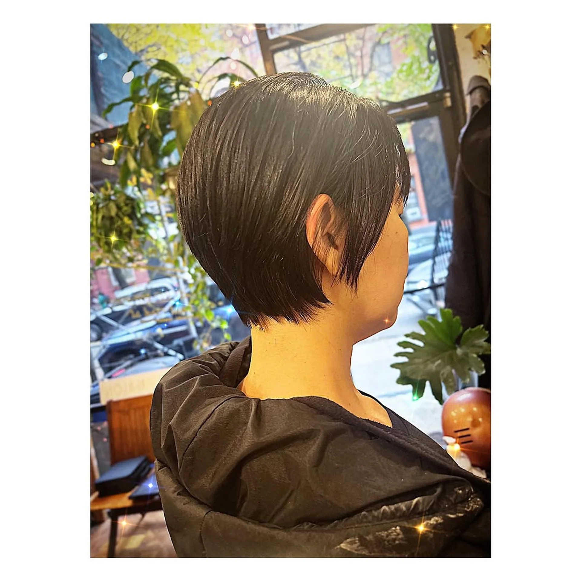 A stylish woman sporting a textured bixie cut with natural waves, a top hairstyle trend for 2025. - Preview 3