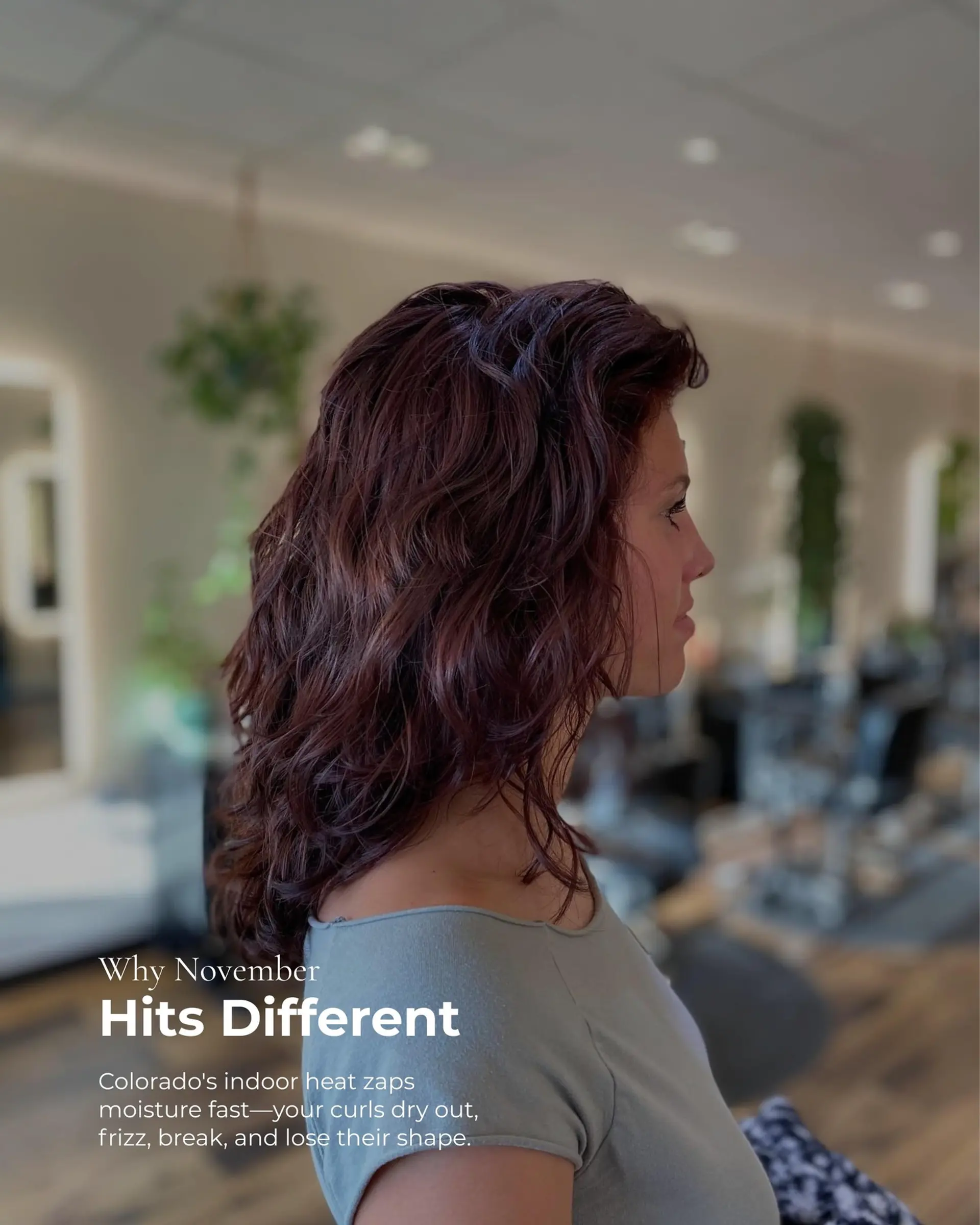 Medium-length layered wavy hairstyle with rich dark auburn tones and natural texture. 1