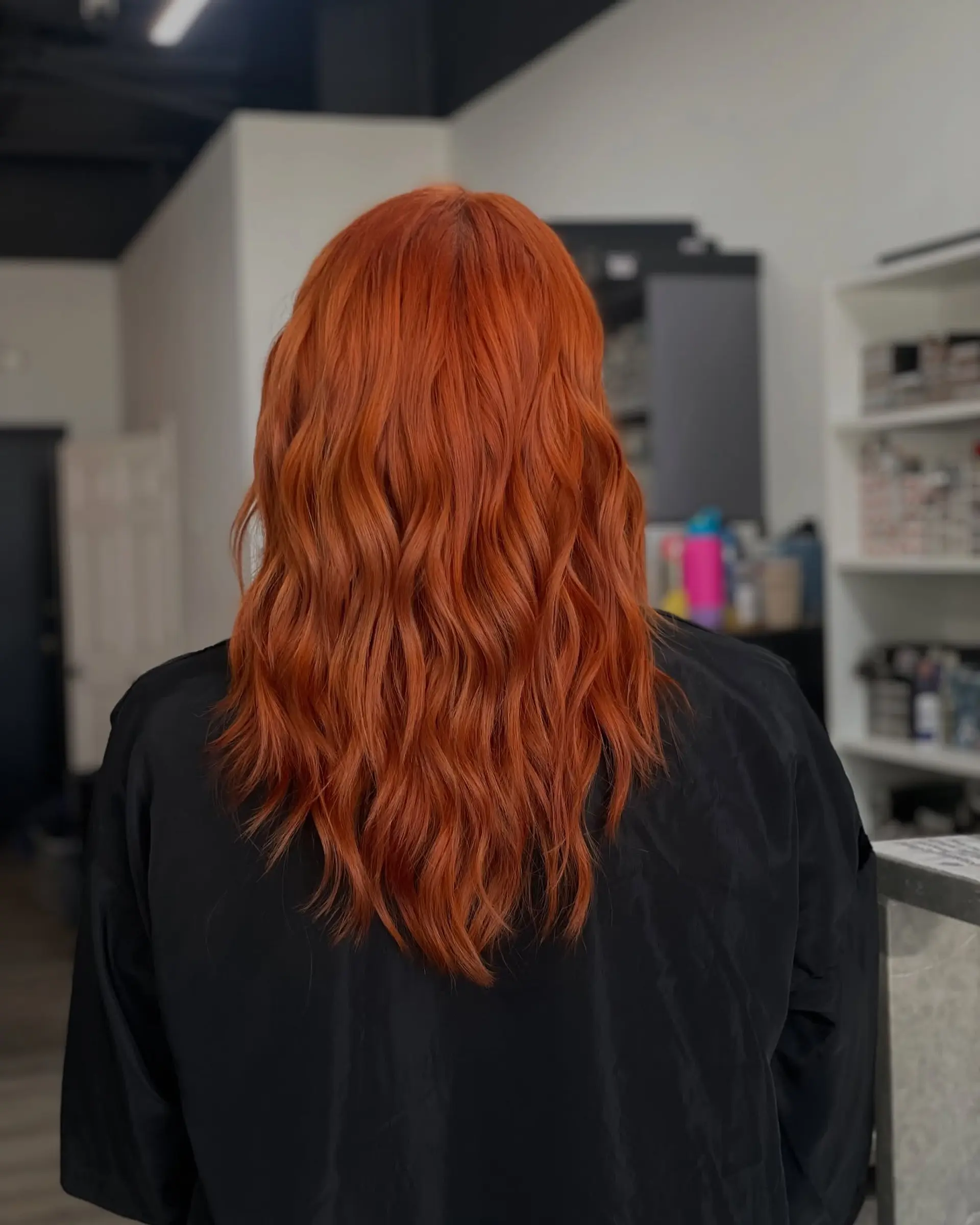 Long, wavy hairstyle with a copper color. 1