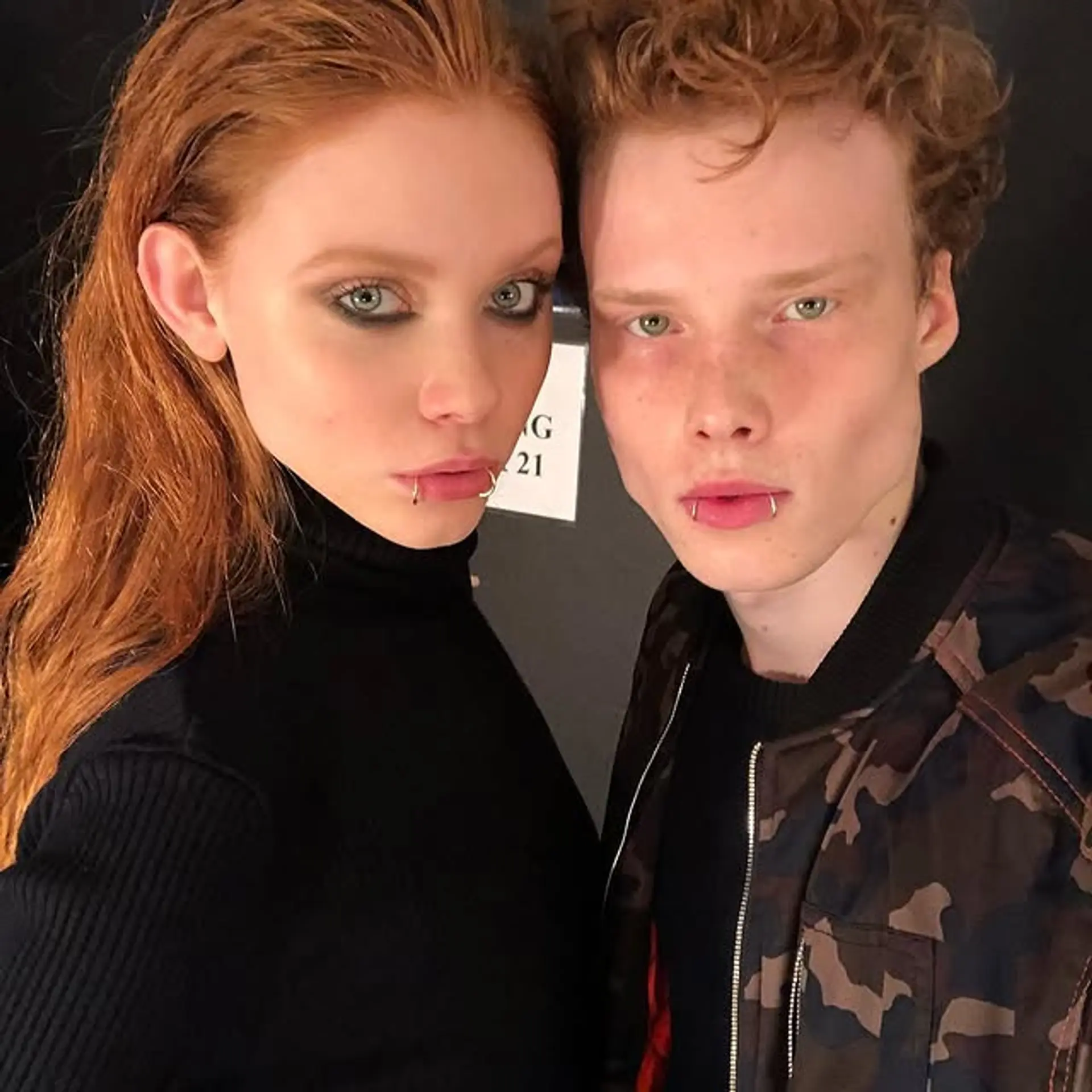 Slicked-back medium length wavy style. 1