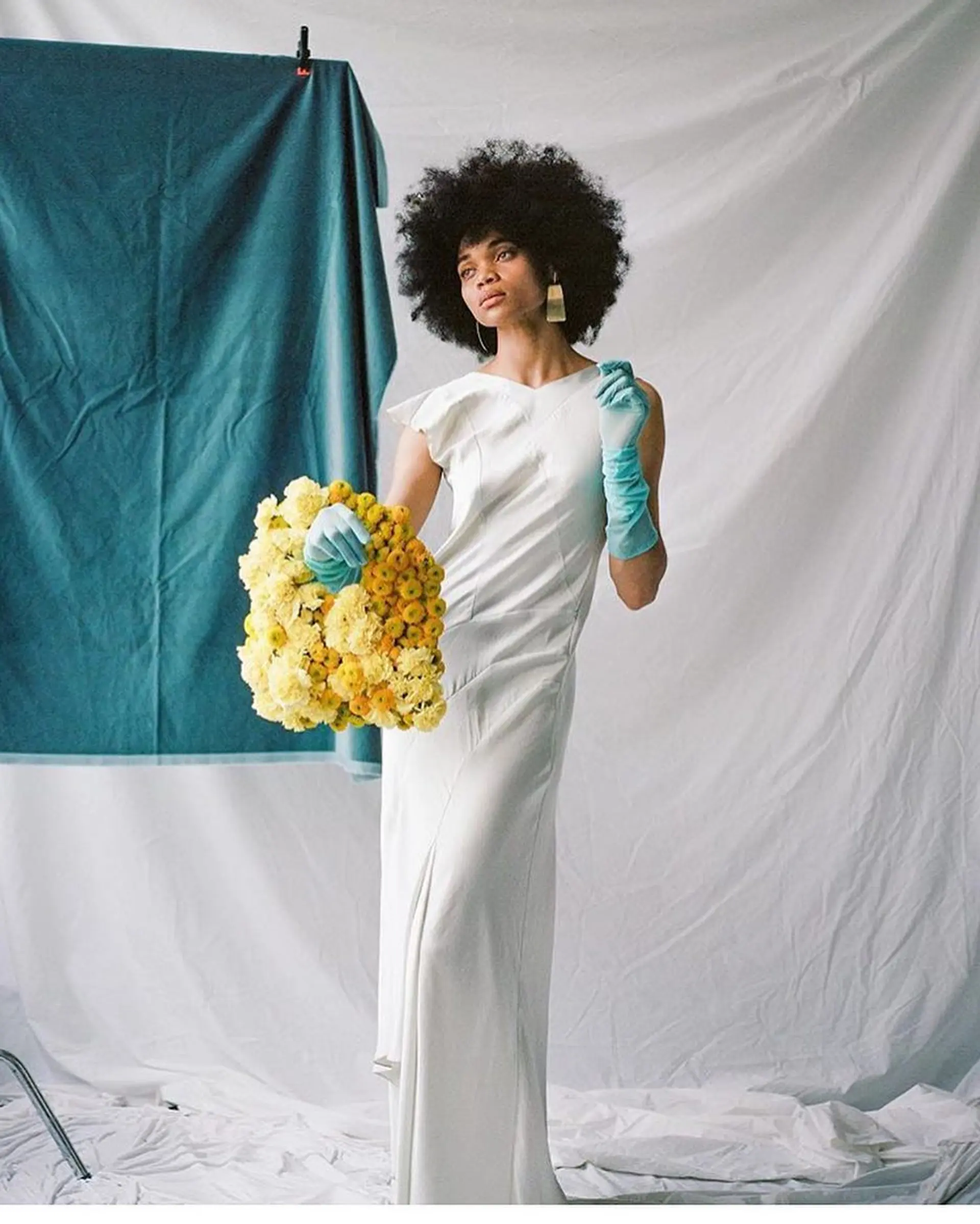 A voluminous, rounded natural afro showcasing full coily texture and sculpted shape. 1