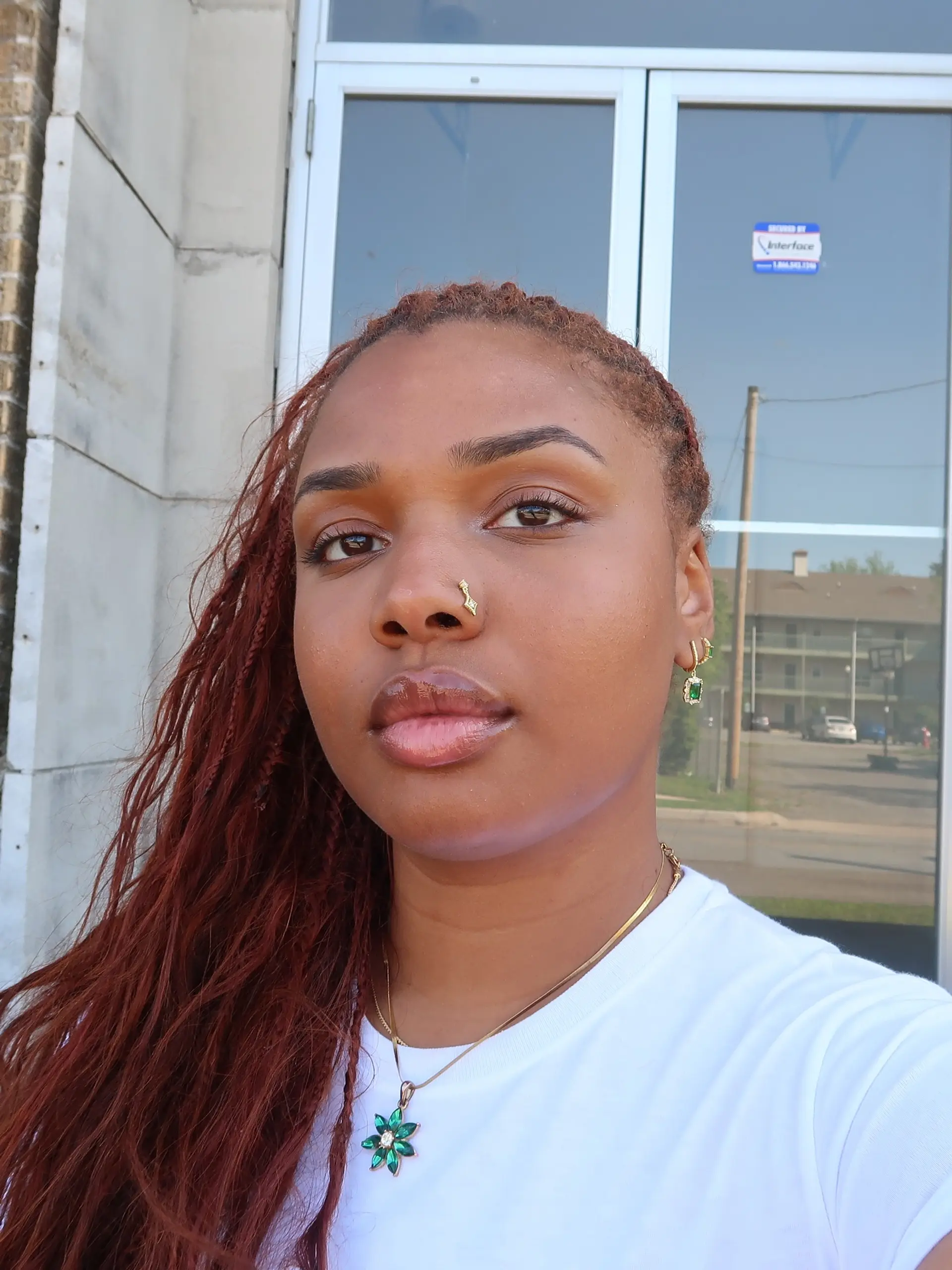 Long copper-auburn micro braids side-swept over the shoulder. 1