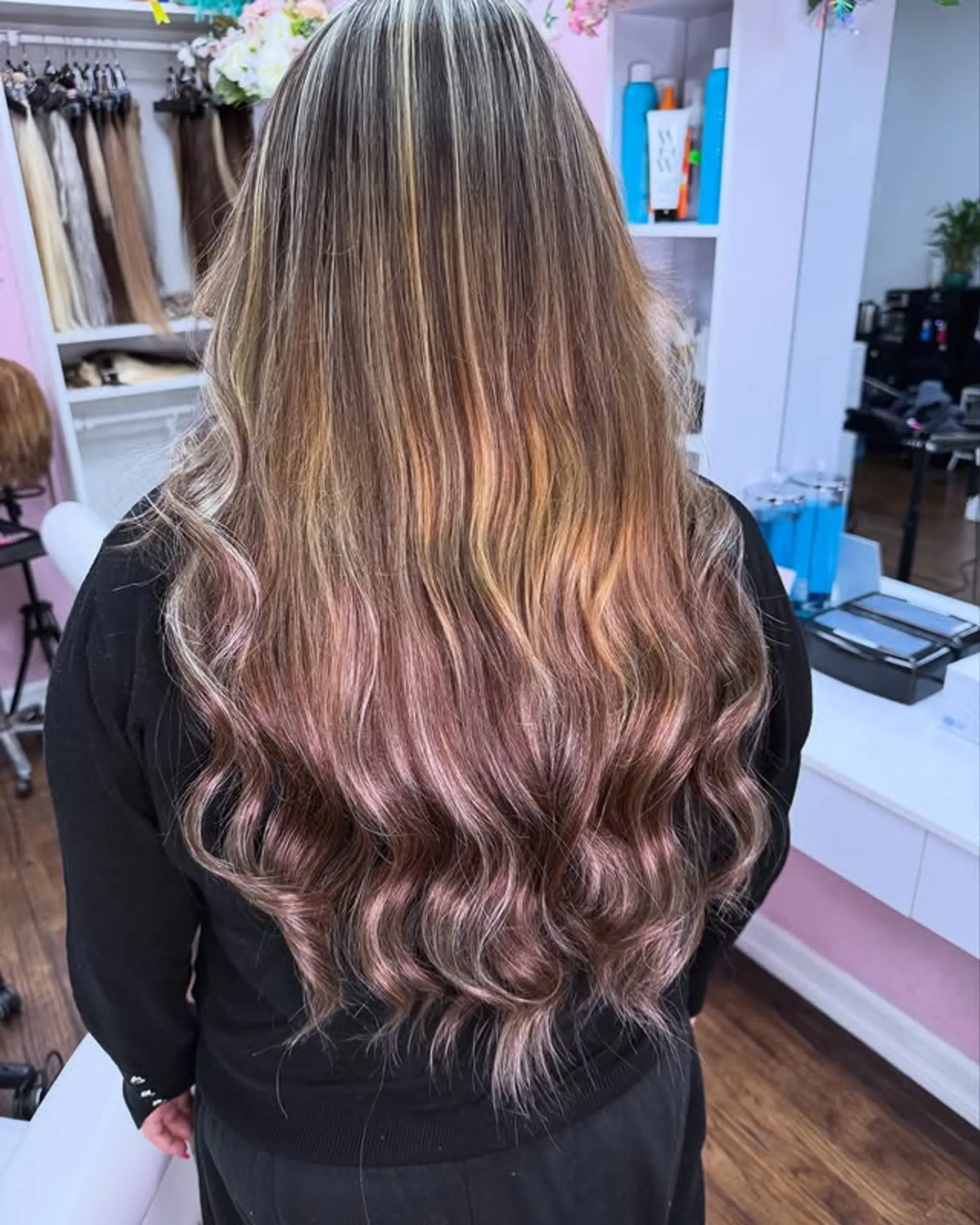 Long, wavy hair with a rose gold ombre effect. 1