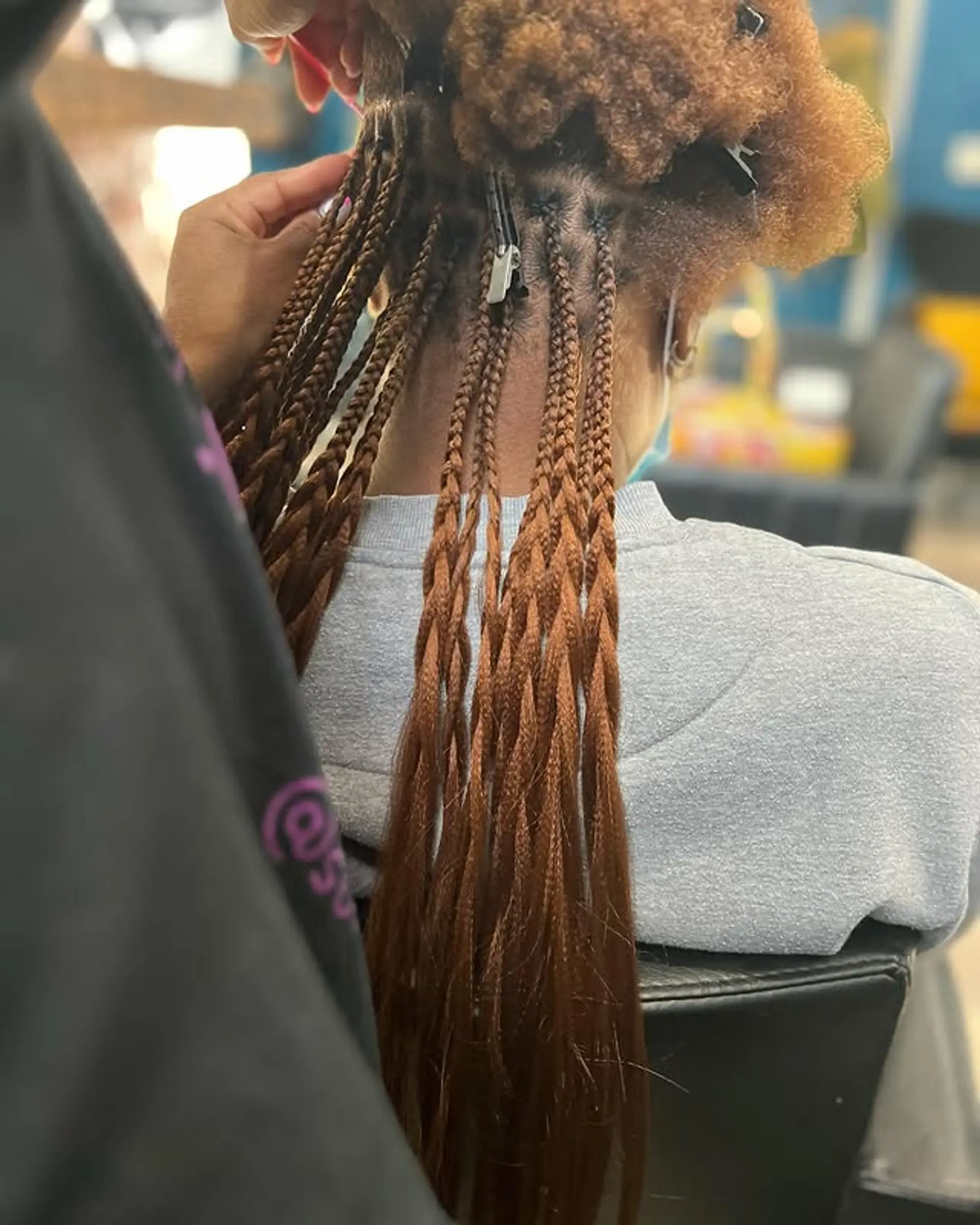 Long, copper-colored box braids. 1