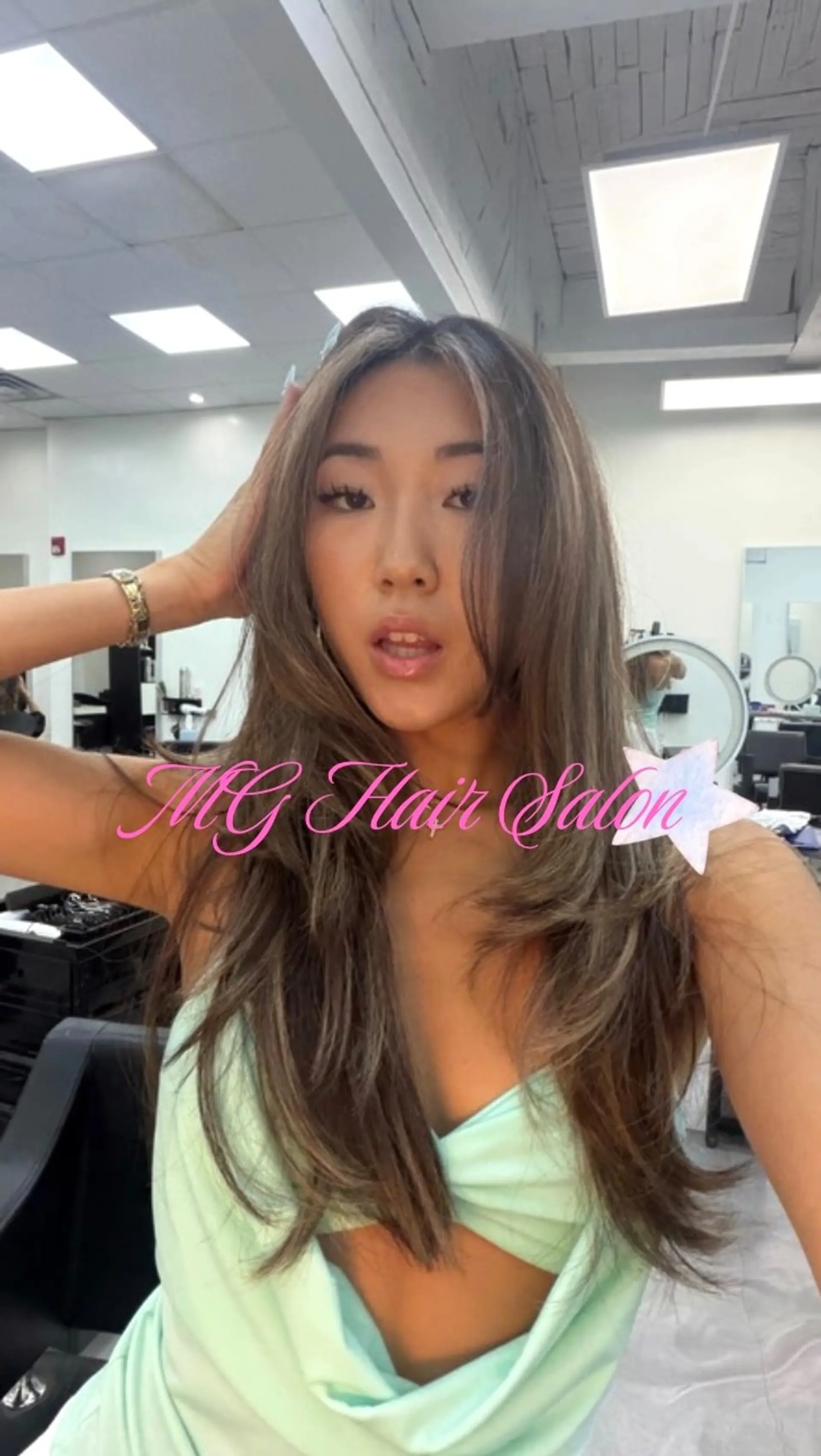 Long ash brown hair with voluminous, face-framing layers styled in a soft blowout. 1