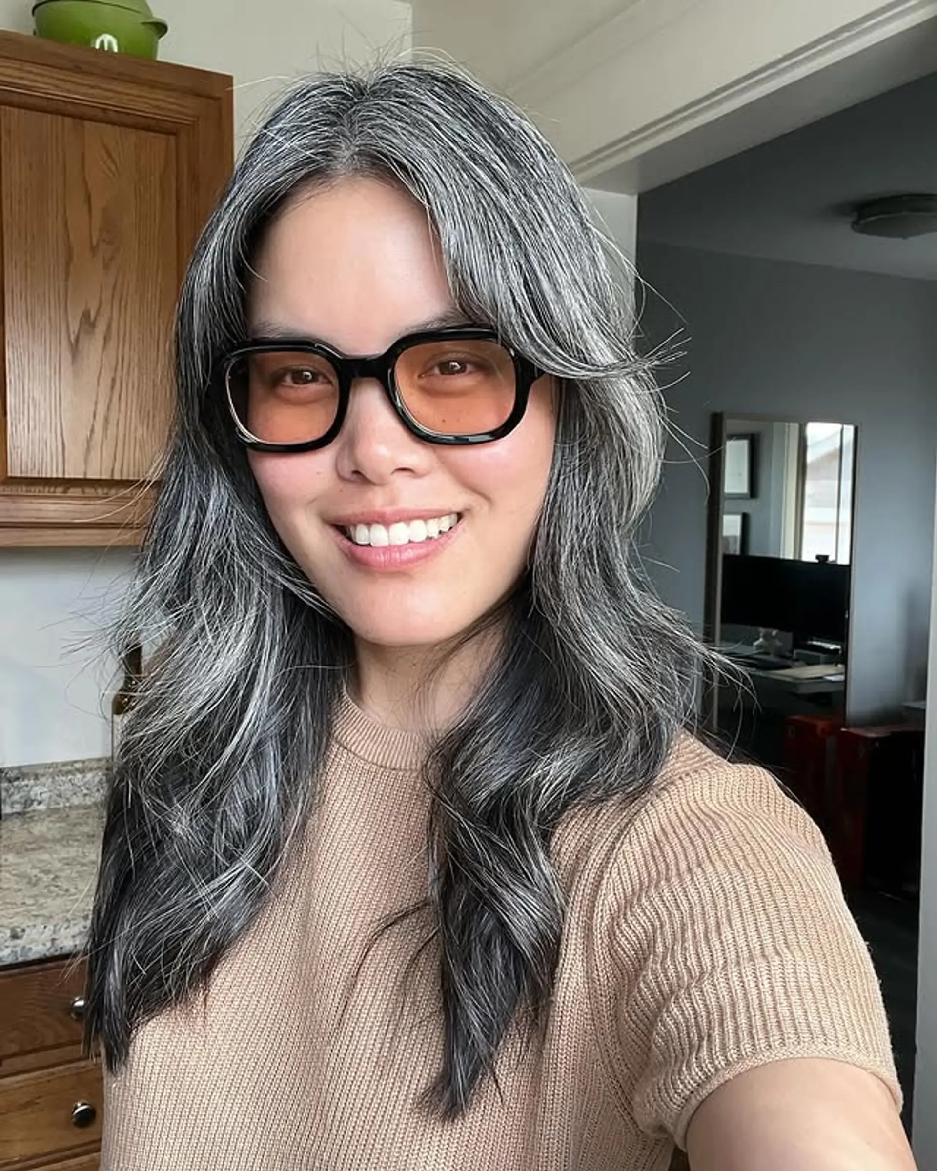 A medium-length wavy style with layers to enhance movement and shape. 1