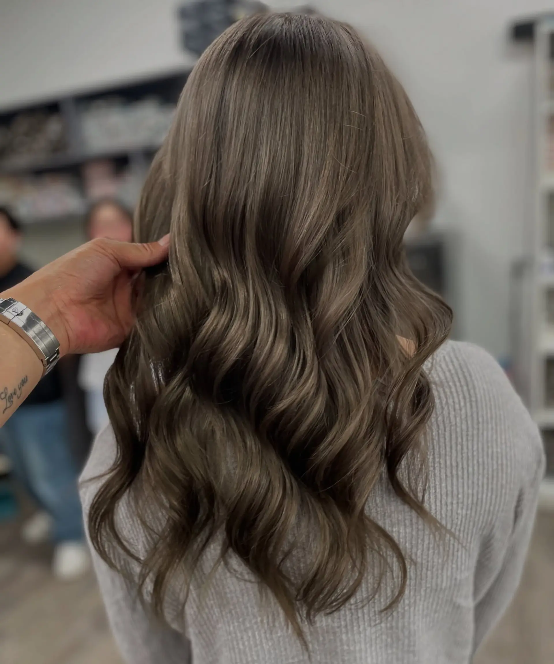 Long, soft waves with a balayage color. 1