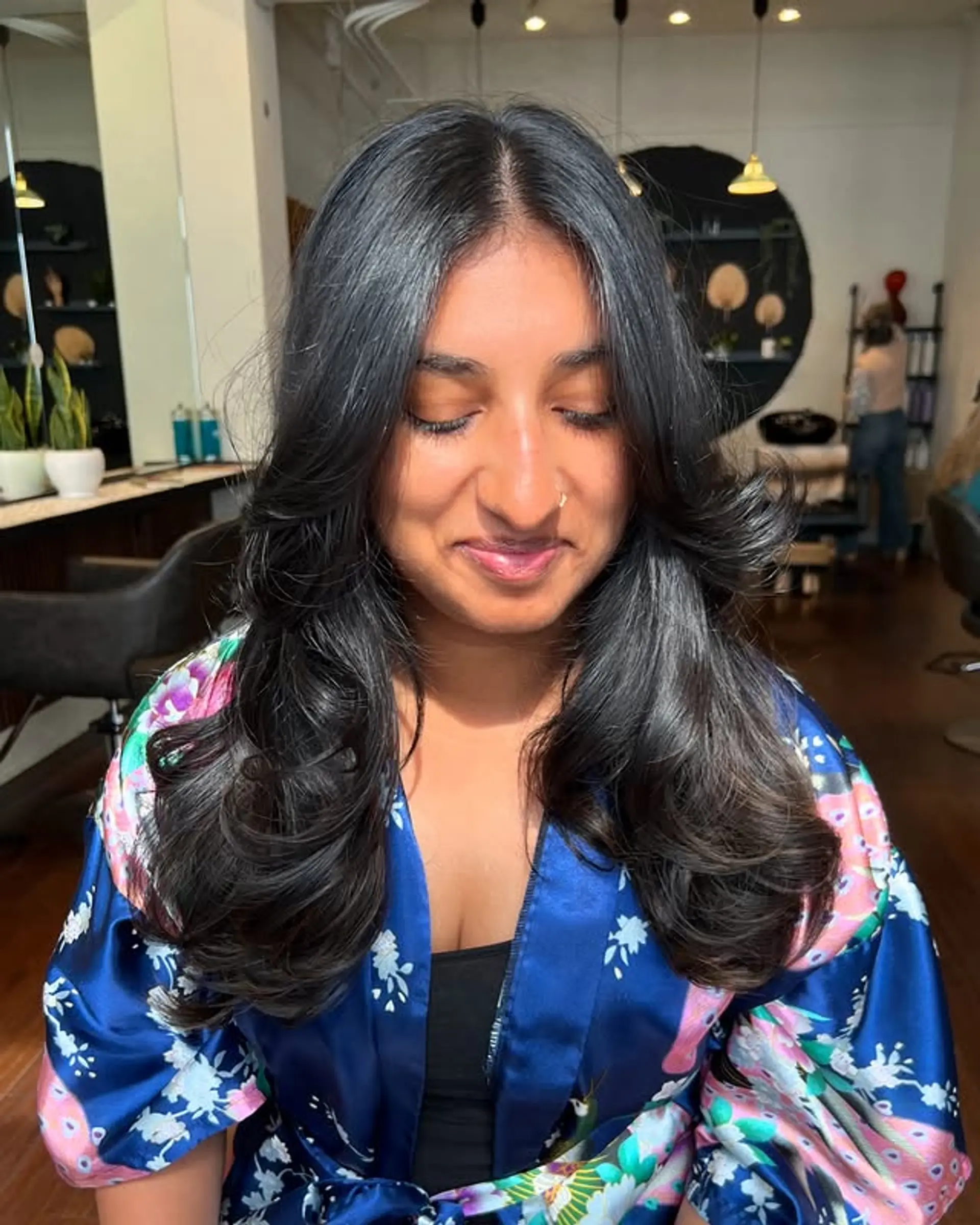 Long layered haircut with face framing layers and a flowy style. 1
