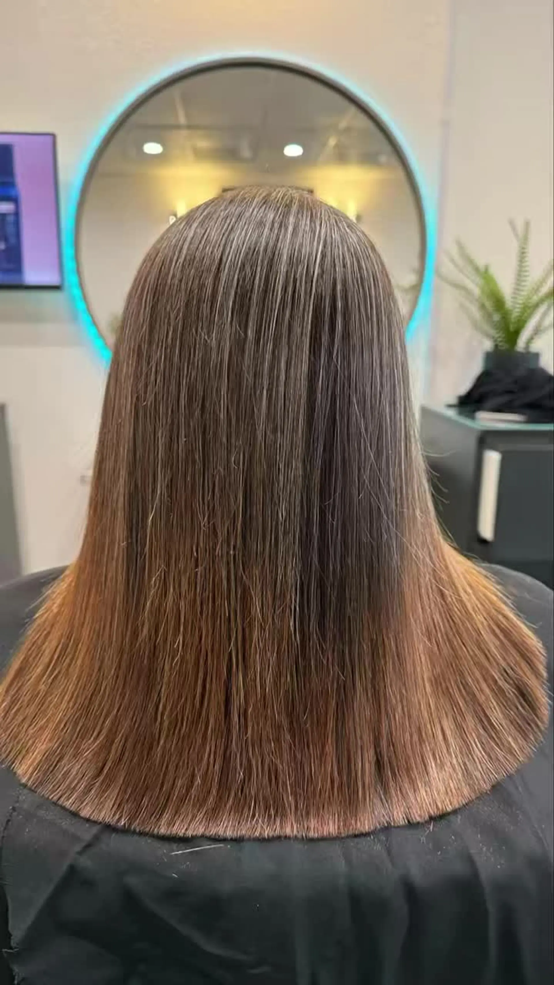 Silky, pin-straight medium-length hair with a precise blunt finish. 1