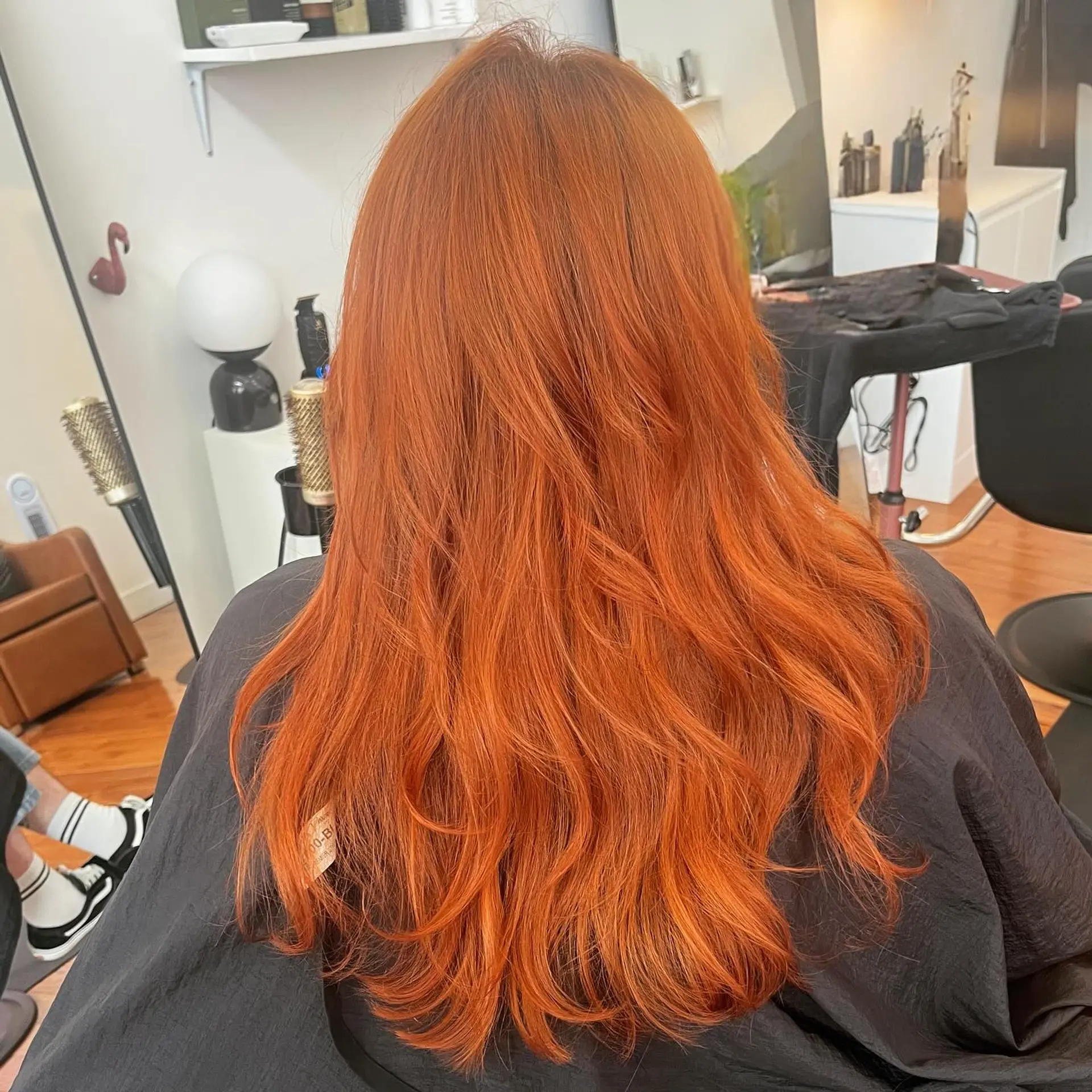 Vibrant ginger-copper all-over color on long, layered hair with soft textured ends. 1