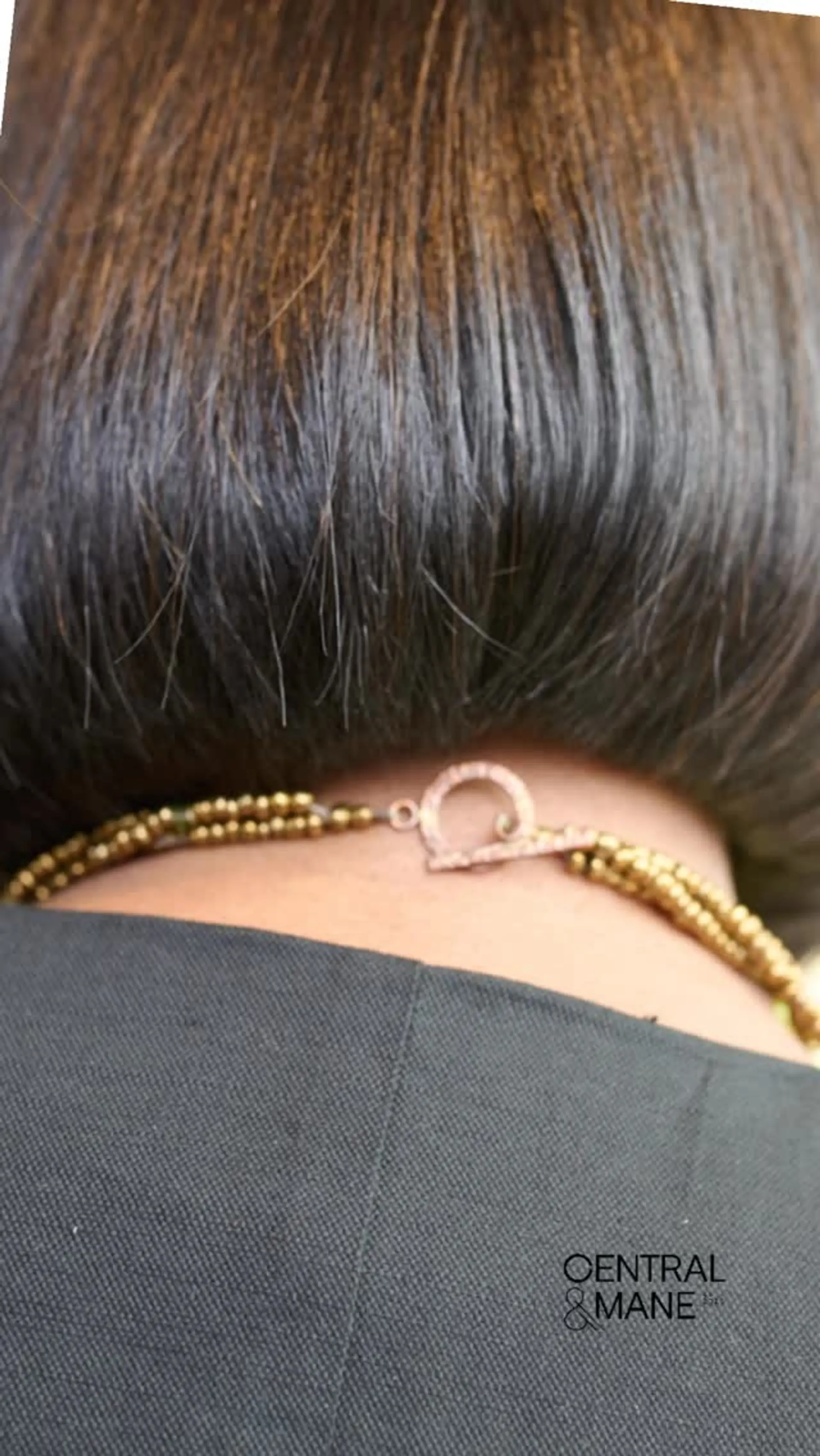 A sleek, precision-cut blunt bob styled straight and resting neatly at the nape of the neck. 1